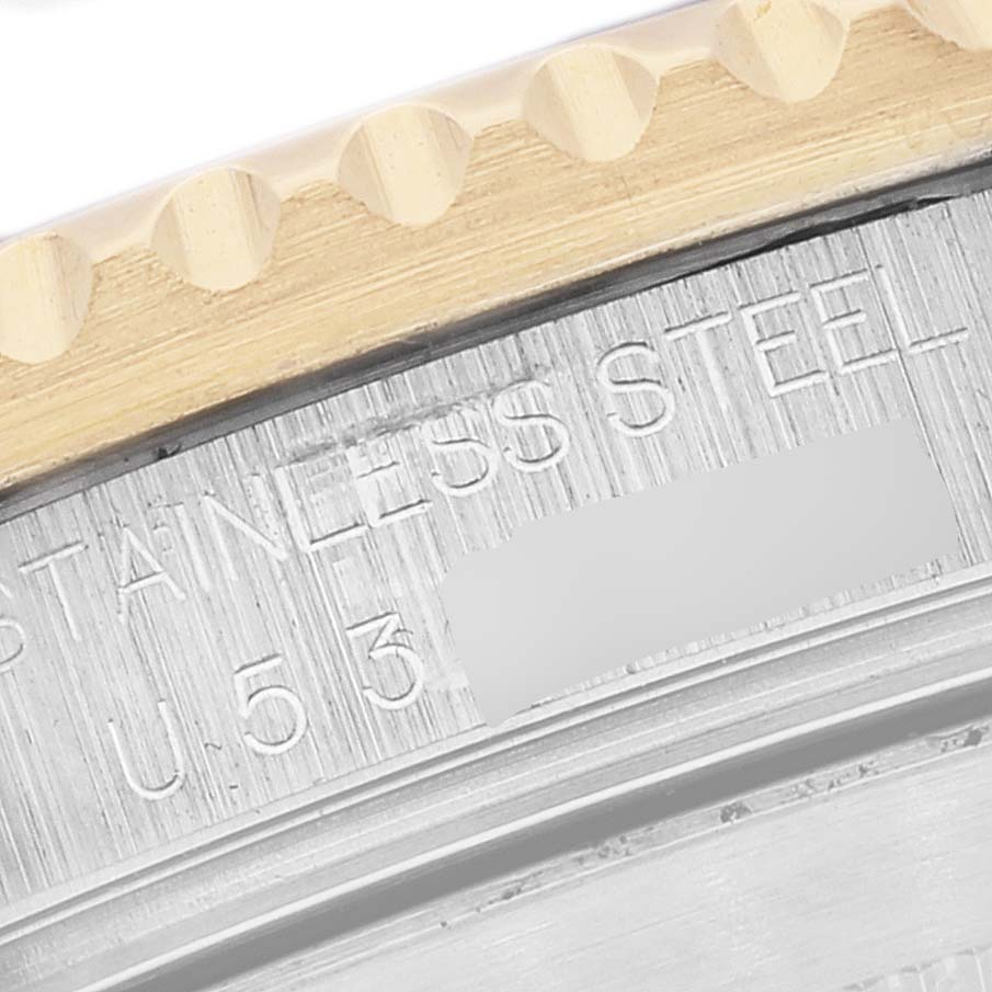 This image shows a close-up angle of the bezel and inner caseback markings of a Rolex Submariner 16613 Men's Steel and Gold (two tone) Blue Dial 16613 Men's Steel and Gold (two tone) Blue Dial watch.