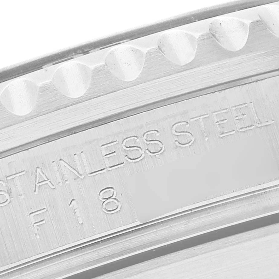 This image shows a close-up of the bezel and inner engraving of a Rolex Submariner 16610 Men
s Stainless Steel Black Dial 16610 Men
s Stainless Steel Black Dial, indicating it
s made of stainless steel.