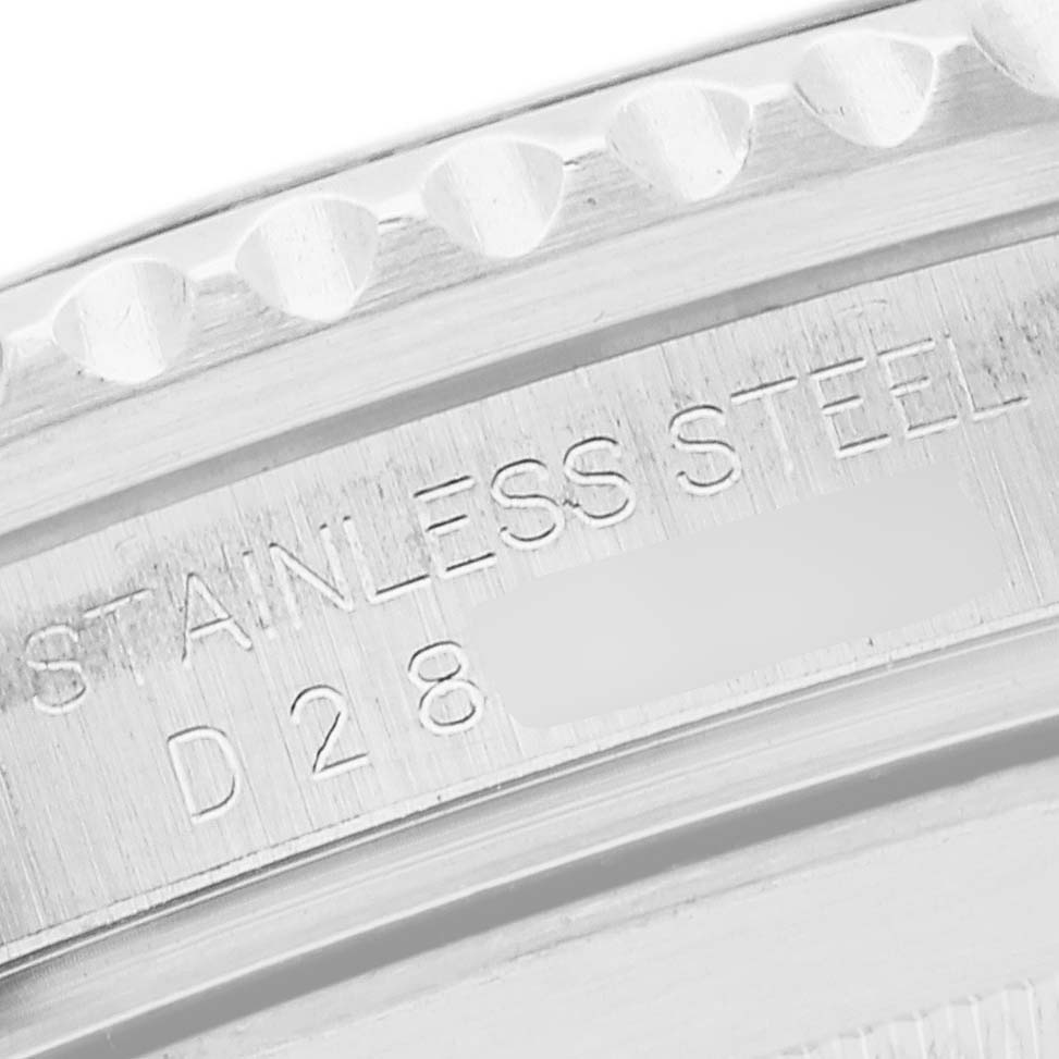 The image shows a close-up view of the stainless steel back casing of a Rolex Submariner 16610 Men
s Stainless Steel Black Dial 16610 Men
s Stainless Steel Black Dial watch, highlighting the engravings.