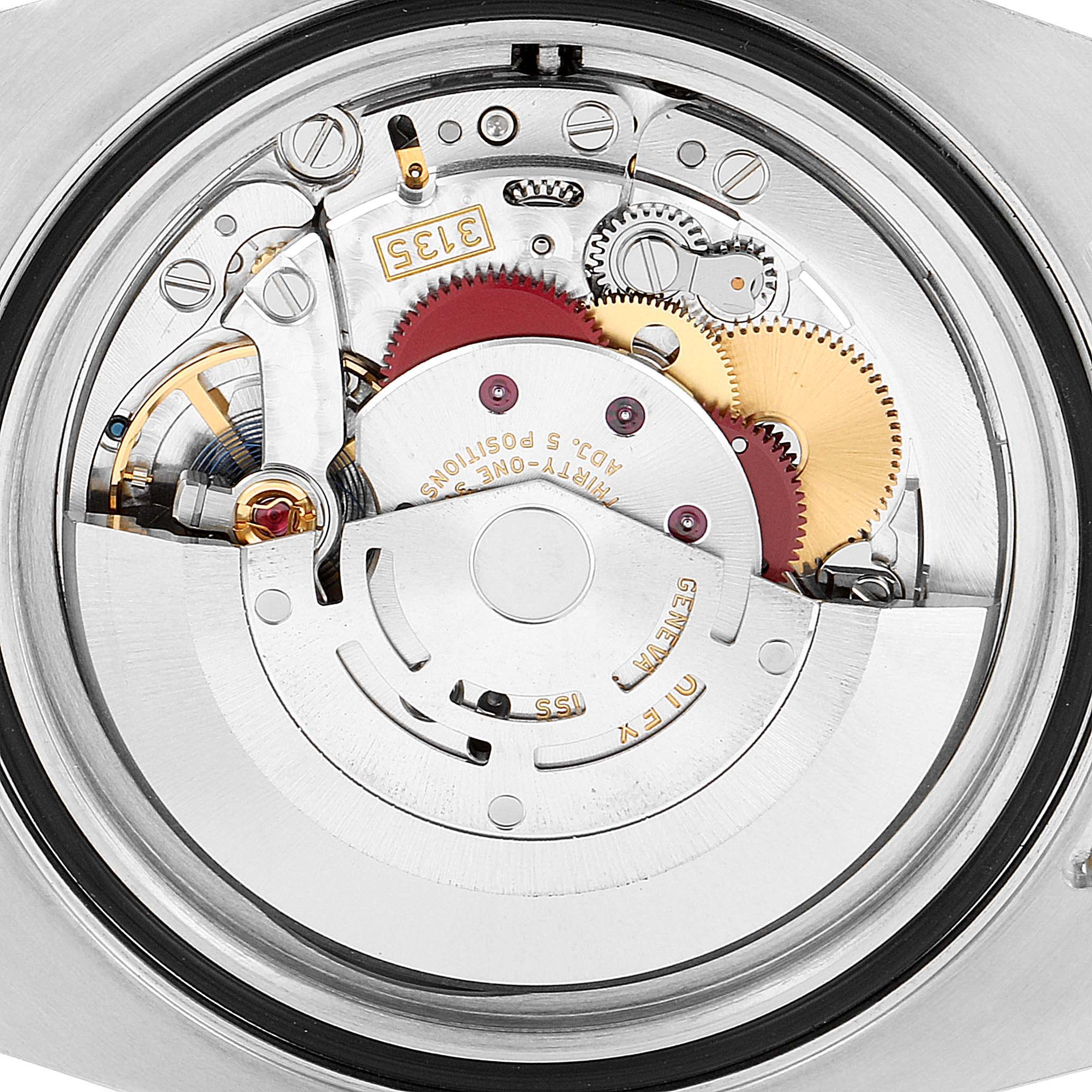 This image shows a close-up of the movement and internal mechanism of the Rolex Submariner 116613 Men's Steel and Gold (two tone) Black Dial 116613 Men's Steel and Gold (two tone) Black Dial watch.