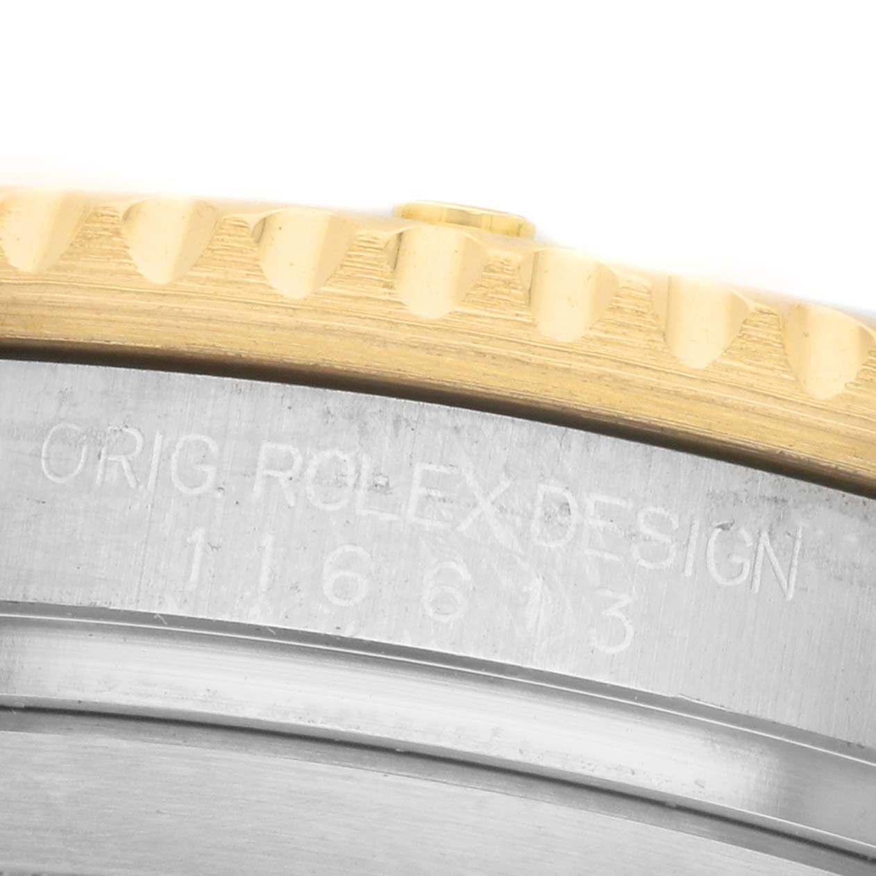 The image shows a close-up of the Rolex Submariner 116613LN Men's Steel and Gold (two tone) Black Dial's case side, highlighting the bezel and engraved model number.