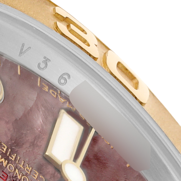 The image shows a close-up of the bezel and partial dial of a Rolex Yacht-Master 16623 Men's Stainless Steel Mother of Pearl Dial, highlighting the gold numerals and index.