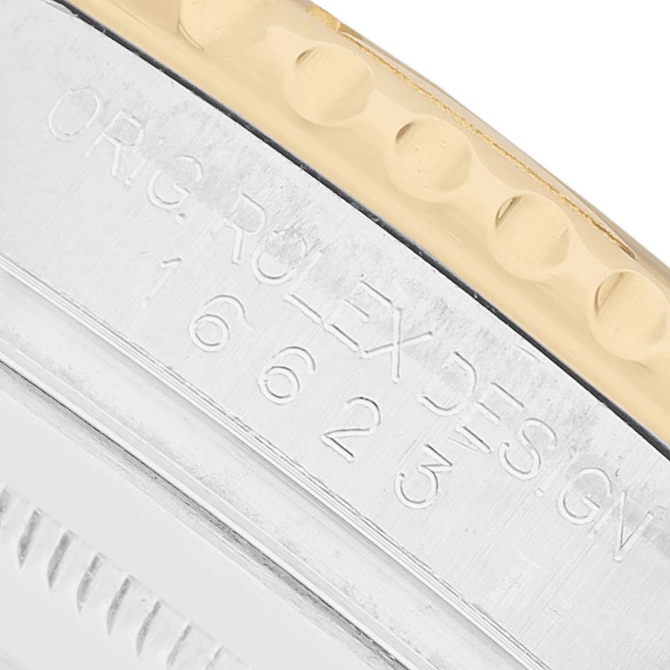 The image shows a close-up of the side of a Rolex Yacht-Master 16623 Men's Stainless Steel Mother of Pearl Dial, highlighting the engraved model number and part of the bezel.
