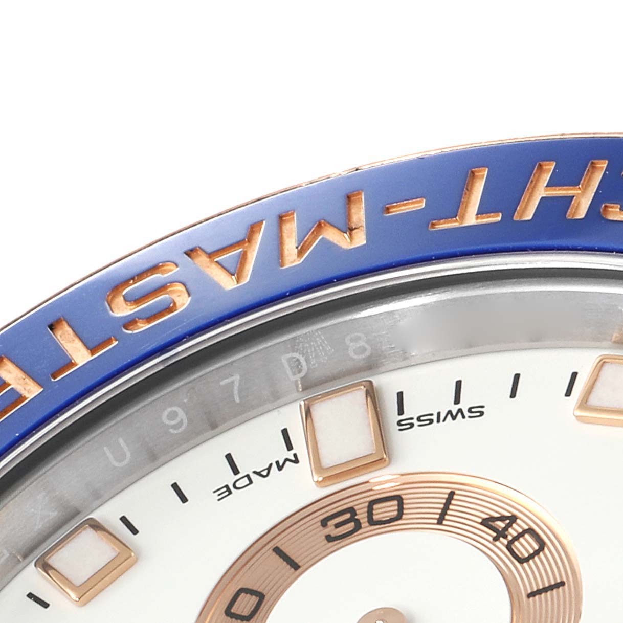 The image shows a close-up of the bezel and partial dial of a Rolex Yacht-Master 116681 Men's Steel and Gold (two tone) White Dial 116681 Men's Steel and Gold (two tone) White Dial watch.