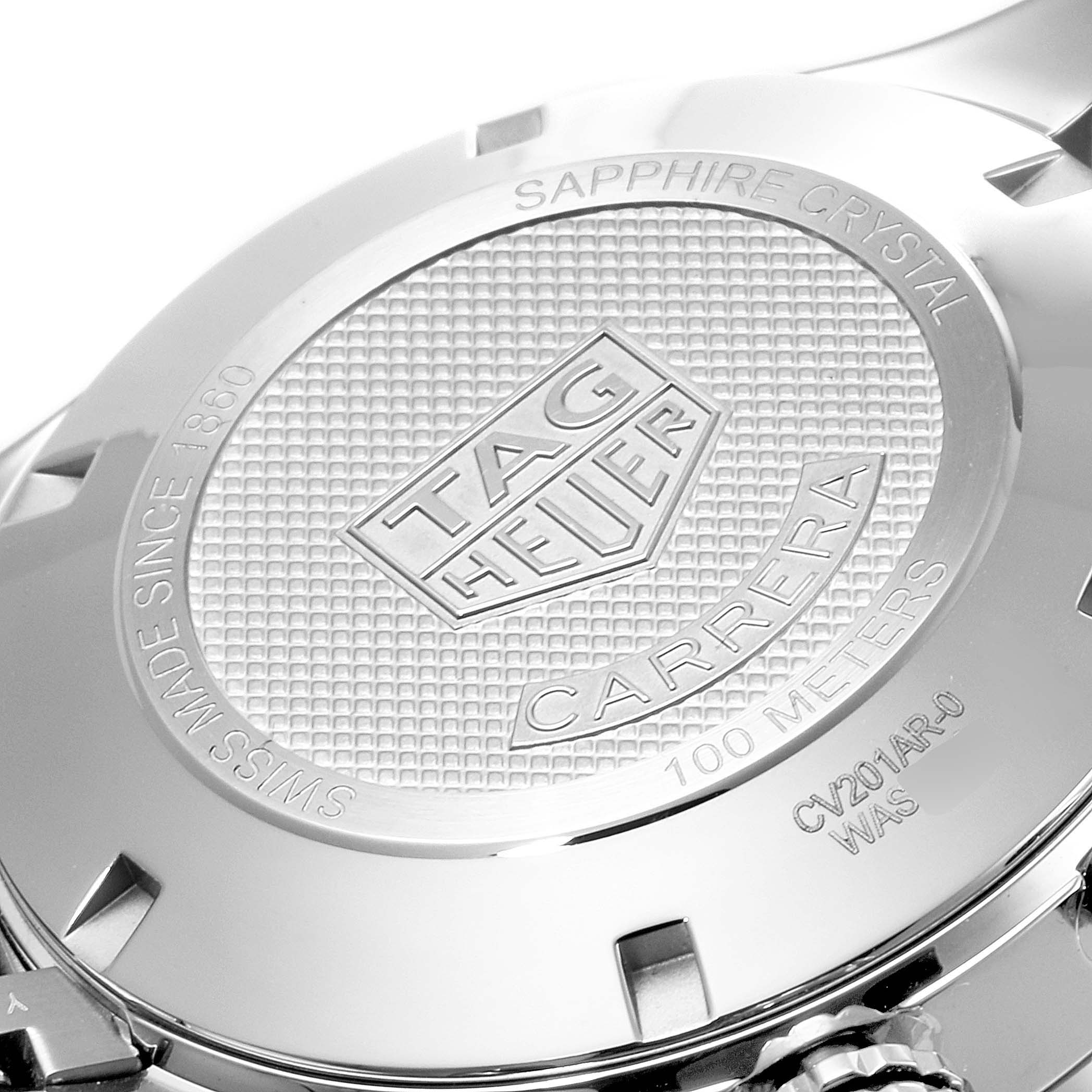 The image shows the back case of a Tag Heuer Carrera CV201AR.BA0715 Men
s Stainless Steel Blue Dial CV201AR.BA0715 Men
s Stainless Steel Blue Dial watch, highlighting the engraved logo and specifications.