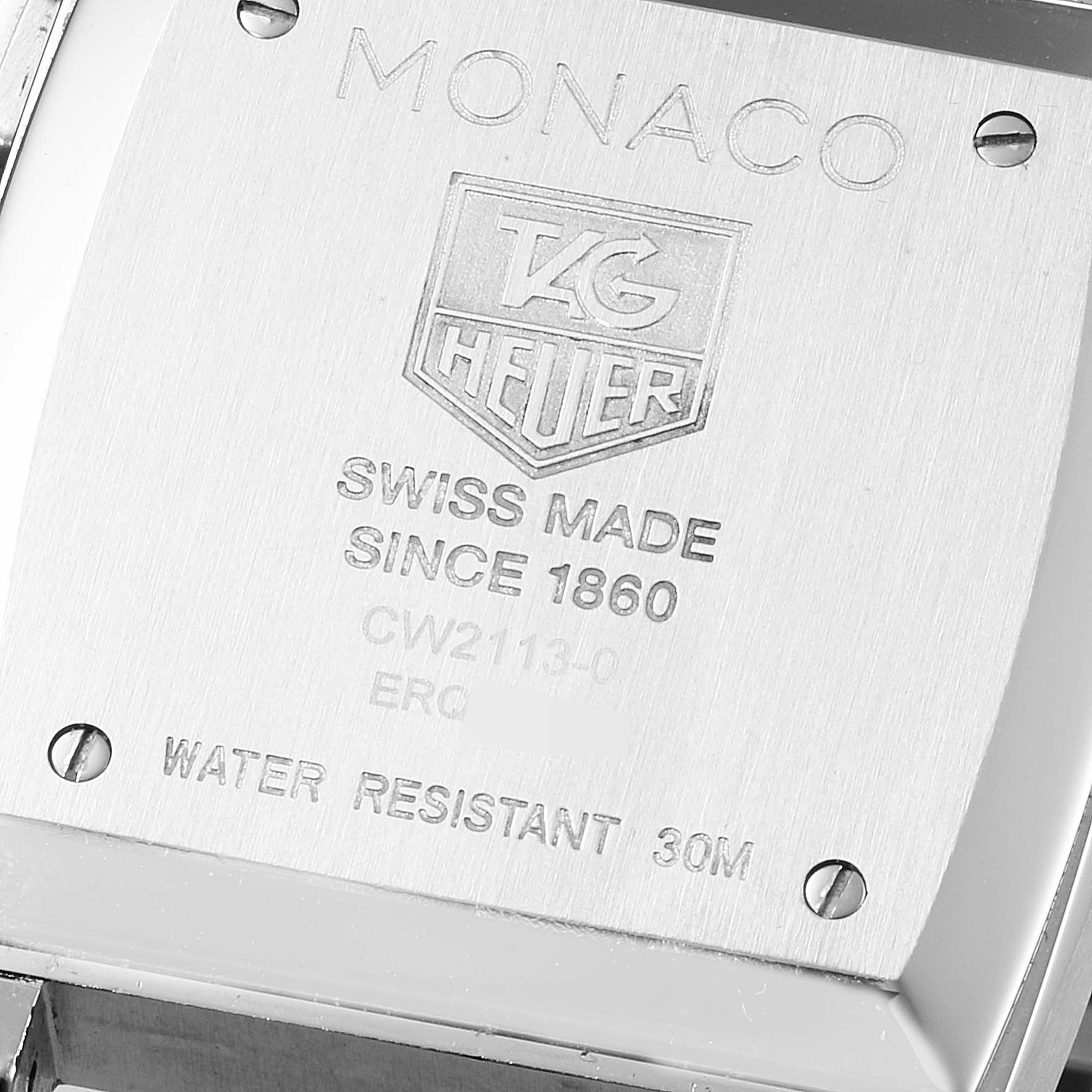 The image shows the back case of the Tag Heuer Monaco CW2113.BA0780 Men's Stainless Steel Blue Dial CW2113.BA0780 Men's Stainless Steel Blue Dial watch, featuring brand engravings and specifications.