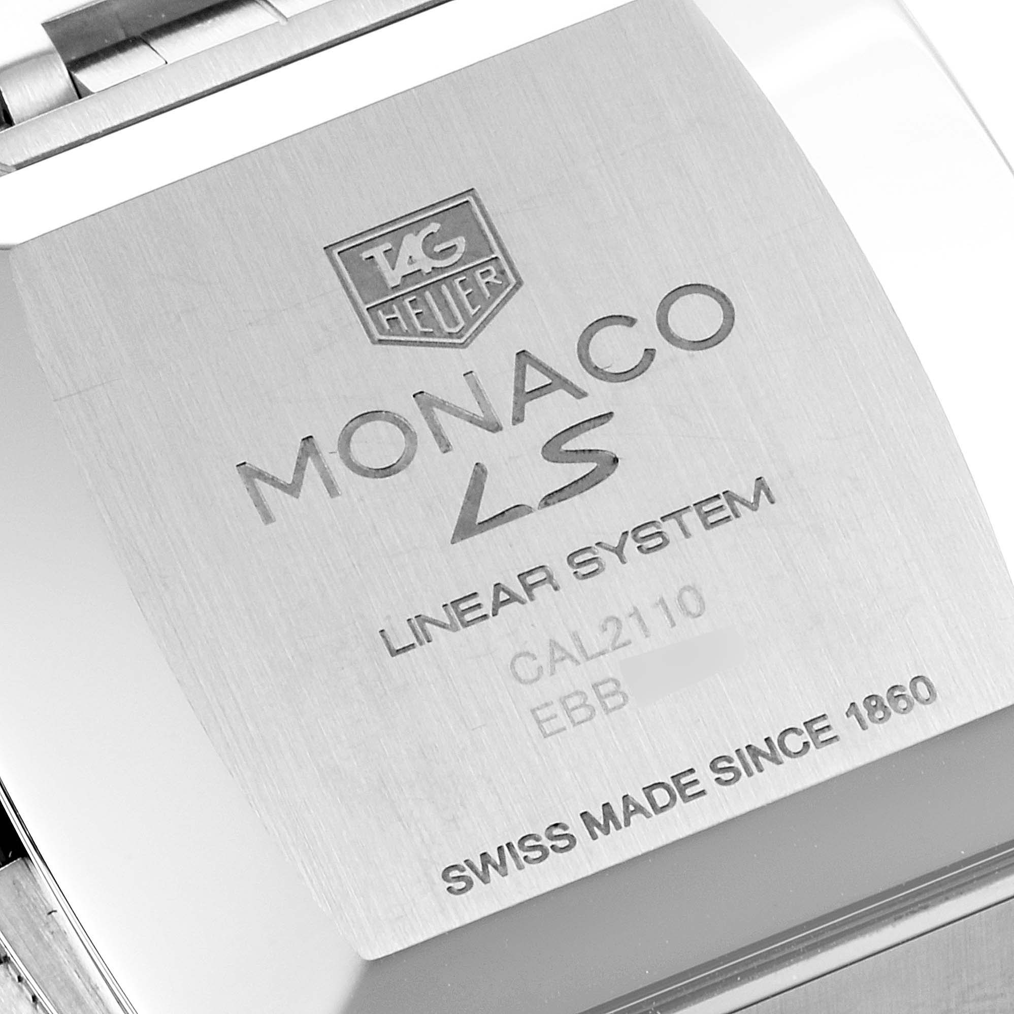 This image shows the engraved back case of a Tag Heuer Monaco CAL2110.BA0781 Men's Stainless Steel Black Dial CAL2110.BA0781 Men's Stainless Steel Black Dial watch, highlighting model details and branding.