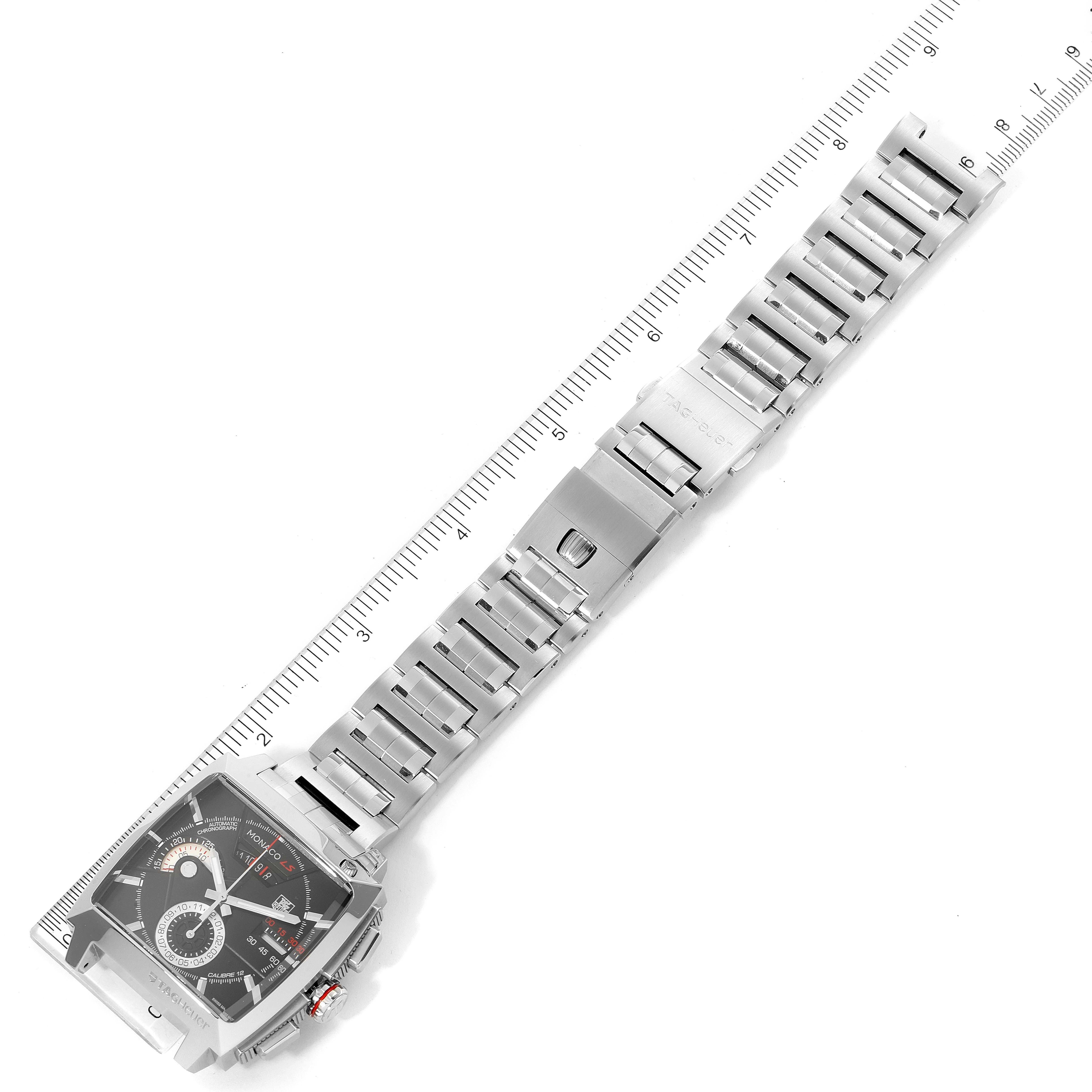 The image shows an overhead view of the Tag Heuer Monaco CAL2110.BA0781 Men's Stainless Steel Black Dial CAL2110.BA0781 Men's Stainless Steel Black Dial watch, highlighting its face and metal bracelet.