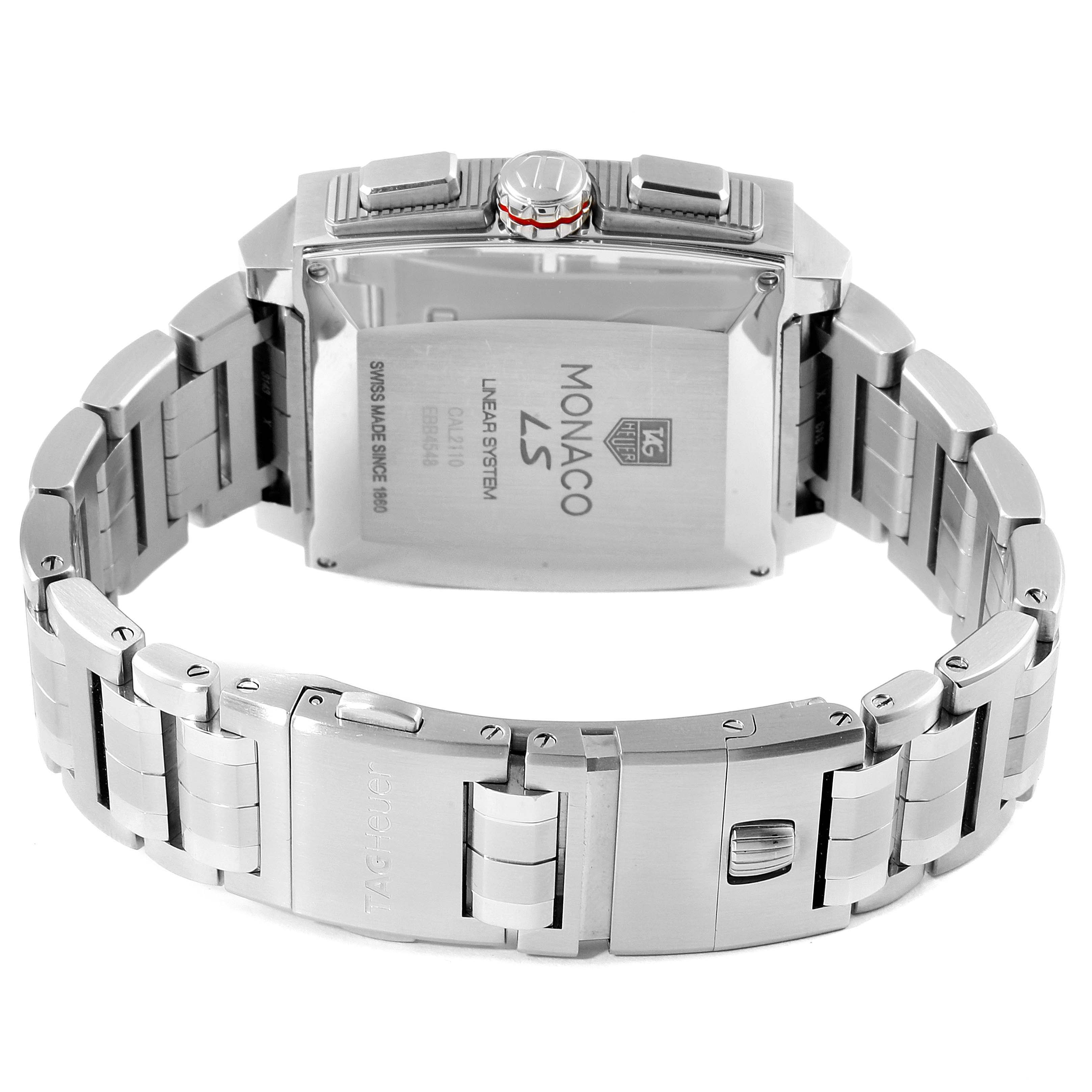 The image shows the back view of a Tag Heuer Monaco CAL2110.BA0781 Men's Stainless Steel Black Dial CAL2110.BA0781 Men's Stainless Steel Black Dial watch, highlighting the case back and metal bracelet.