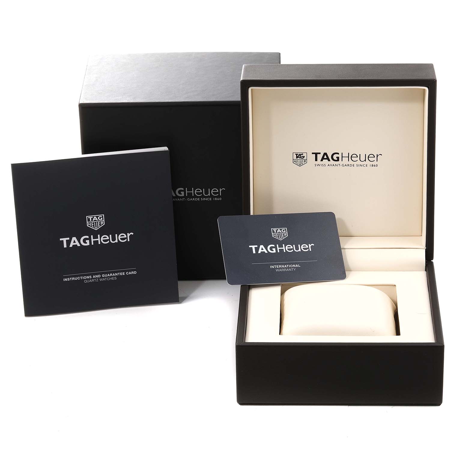 The image shows the packaging, instruction manual, and warranty card for a Tag Heuer Monaco WAW131E.FC6420 Women's Stainless Steel Brown Dial WAW131E.FC6420 Women's Stainless Steel Brown Dial watch.