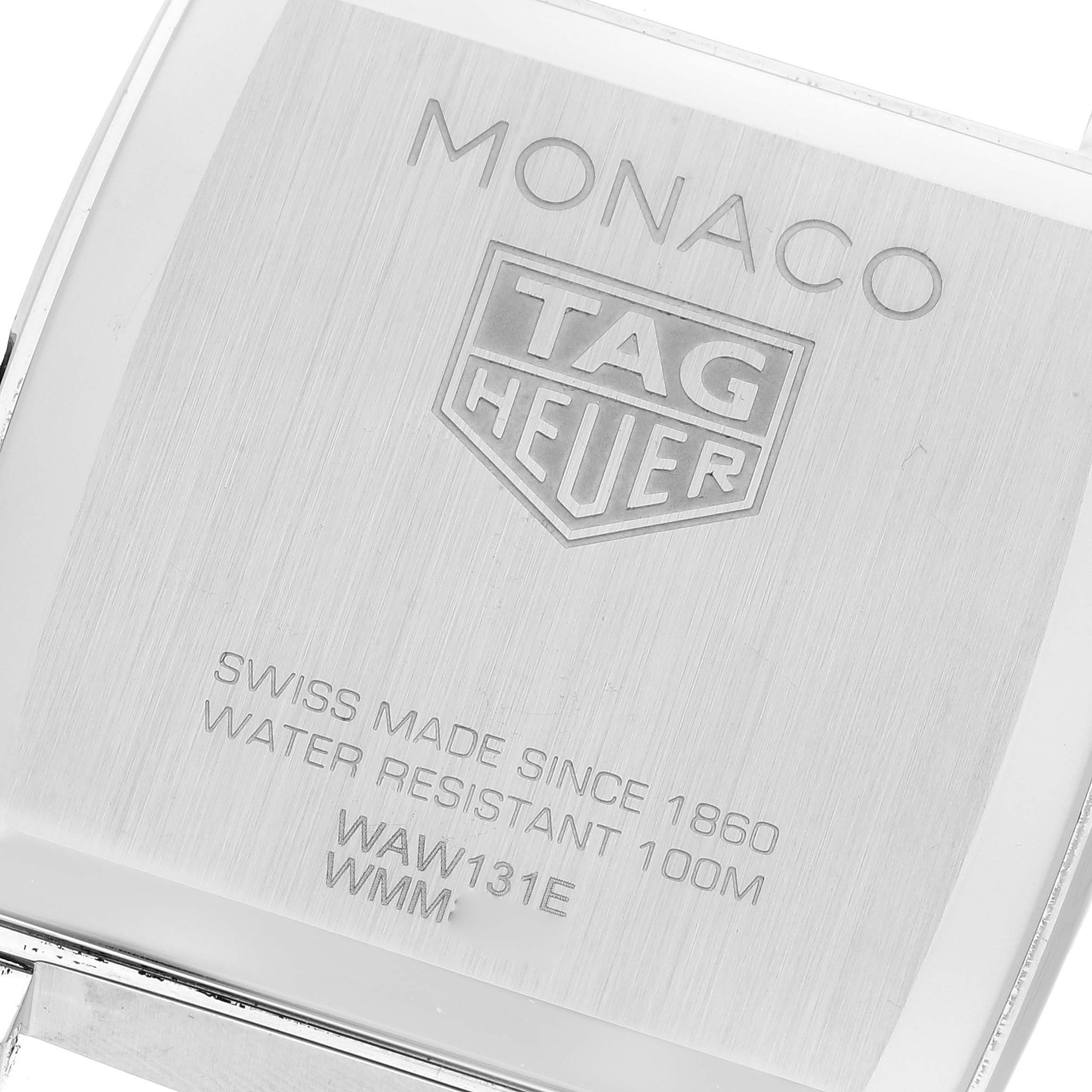 The image shows the back casing of a Tag Heuer Monaco WAW131E.FC6420 Women's Stainless Steel Brown Dial WAW131E.FC6420 Women's Stainless Steel Brown Dial watch with engravings.