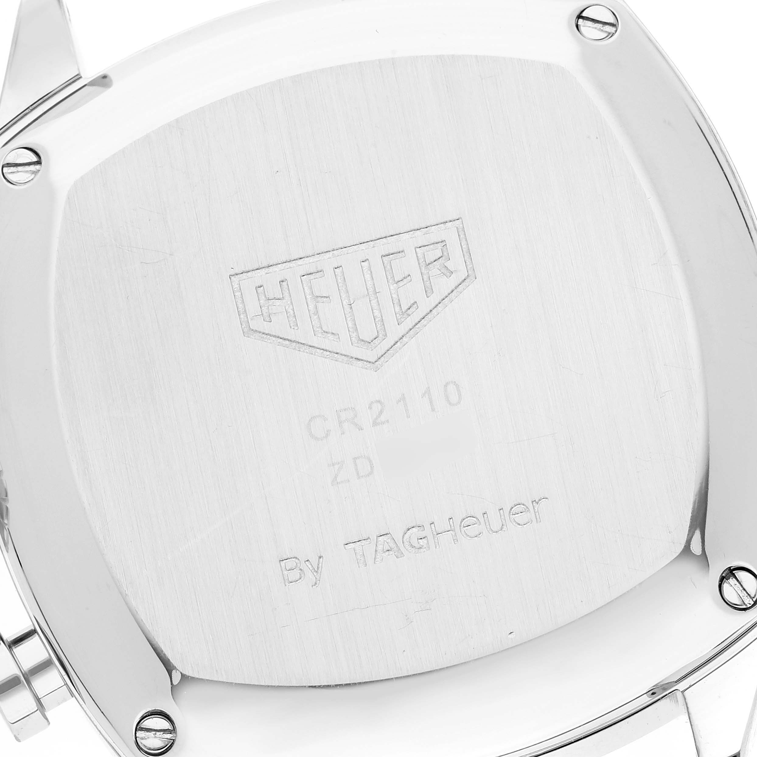 This image shows the back case of the Tag Heuer Monza CR2110 Men's Stainless Steel Black Dial CR2110 Men's Stainless Steel Black Dial watch, displaying its brand engravings.