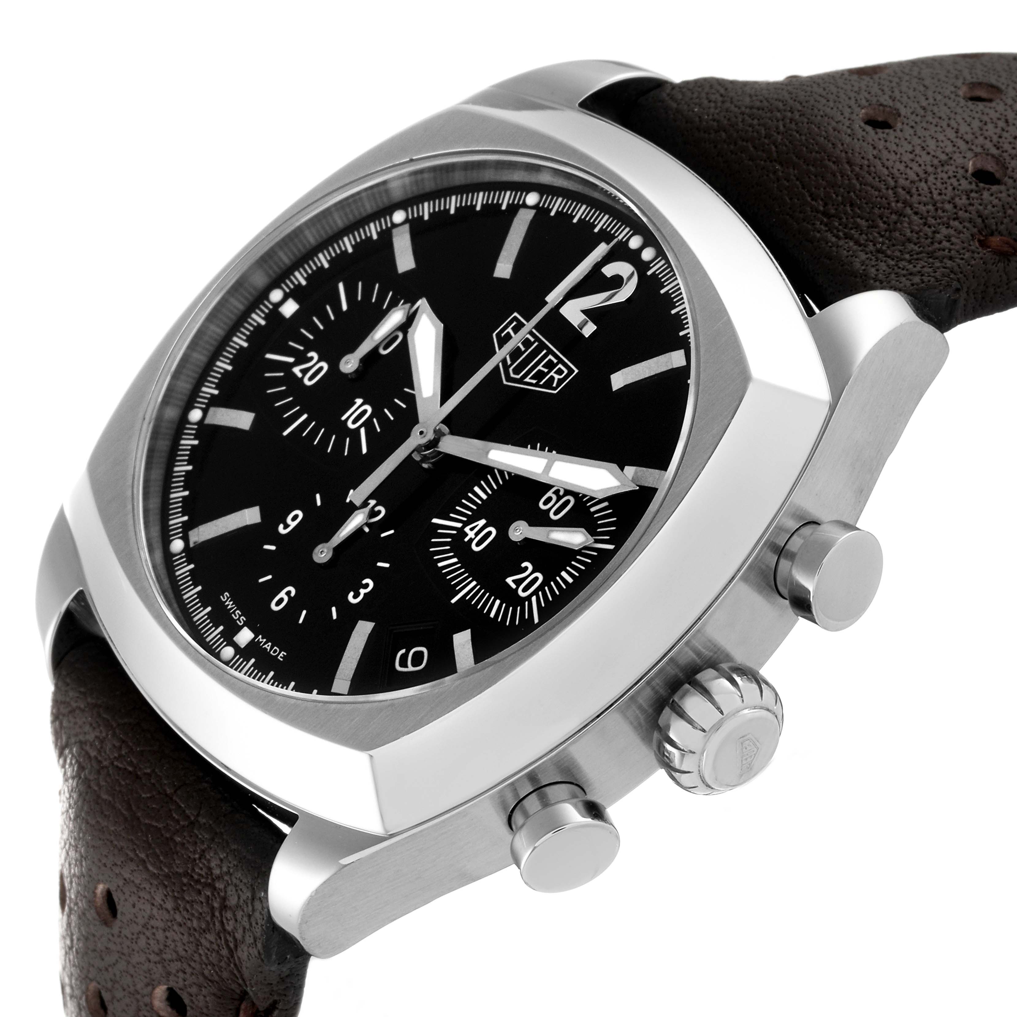 The image shows a side angle of the Tag Heuer Monza CR2110 Men's Stainless Steel Black Dial CR2110 Men's Stainless Steel Black Dial watch, highlighting the dial, crown, pushers, and brown perforated leather strap.