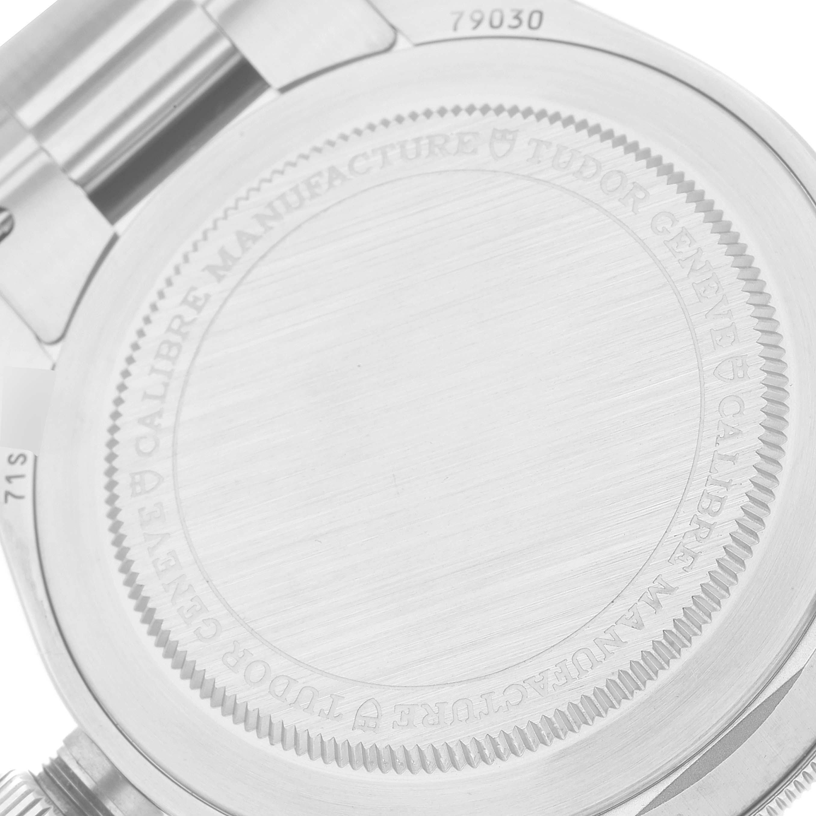 The image shows the back case of a Tudor Heritage Black Bay M79030N-0001 Men
s Stainless Steel Black Dial M79030N-0001 Men
s Stainless Steel Black Dial watch, focusing on its engraved details.