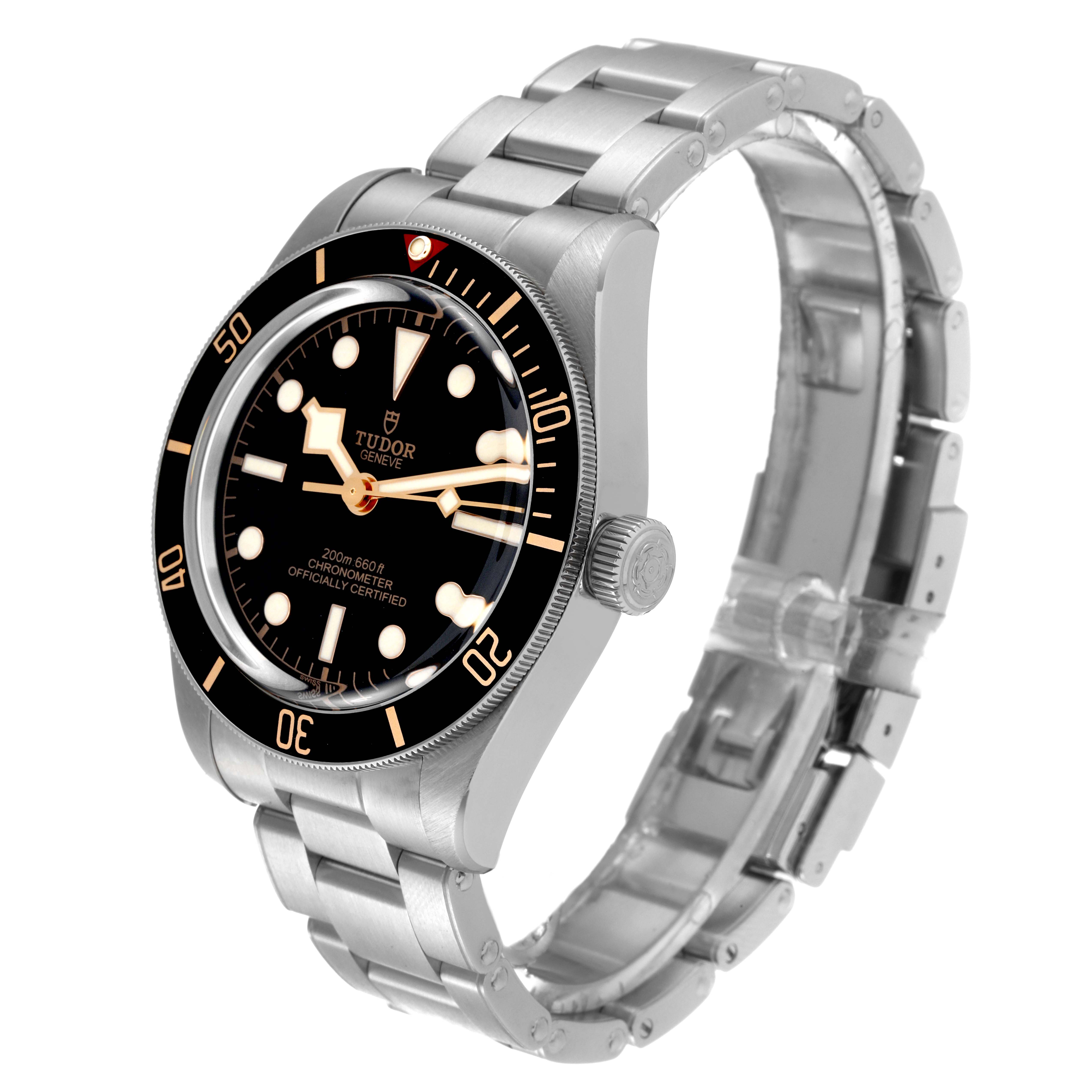 The image shows the Tudor Heritage Black Bay M79030N-0001 Men
s Stainless Steel Black Dial M79030N-0001 Men
s Stainless Steel Black Dial watch at an angle displaying its face, bezel, crown, and metal bracelet.