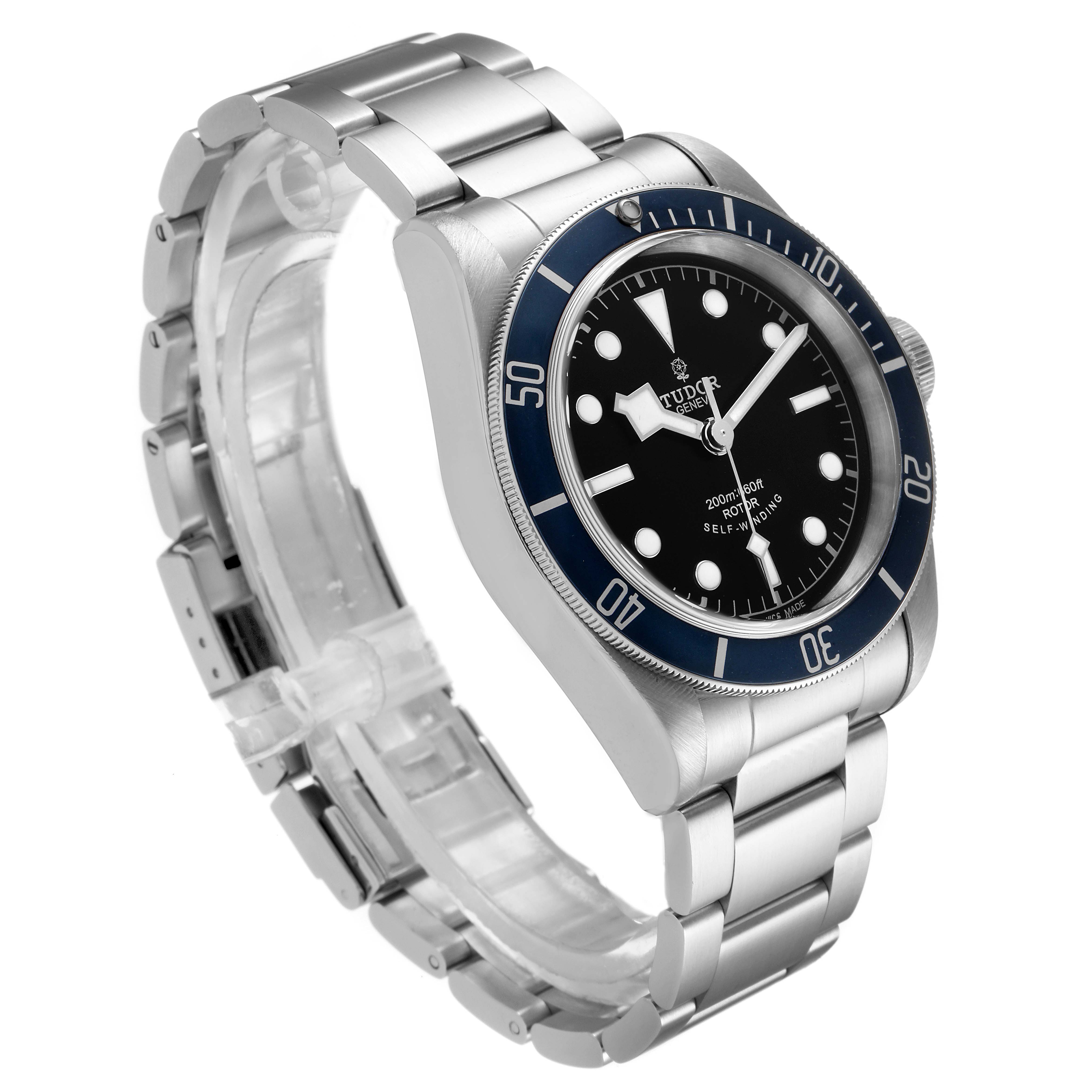 The Tudor Heritage Black Bay 79220 Men's Stainless Steel Black Dial 79220 Men's Stainless Steel Black Dial watch is shown at an angled side view, highlighting its bracelet, bezel, crown, and dial.