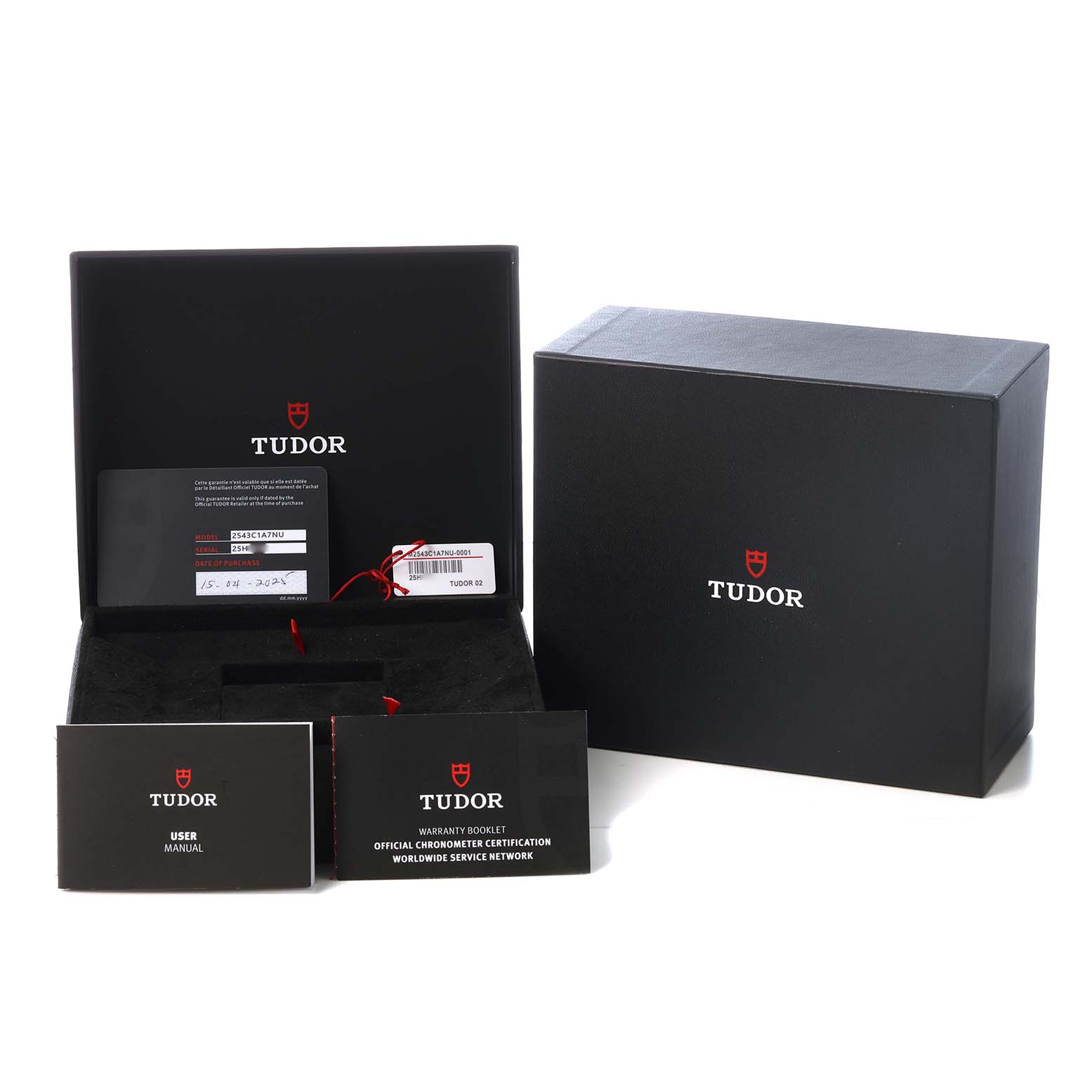 The image shows an open Tudor Pelagos M2543C1A7NU-0001 Men's Titanium Black Dial box with manuals and a warranty card, along with the outer box.