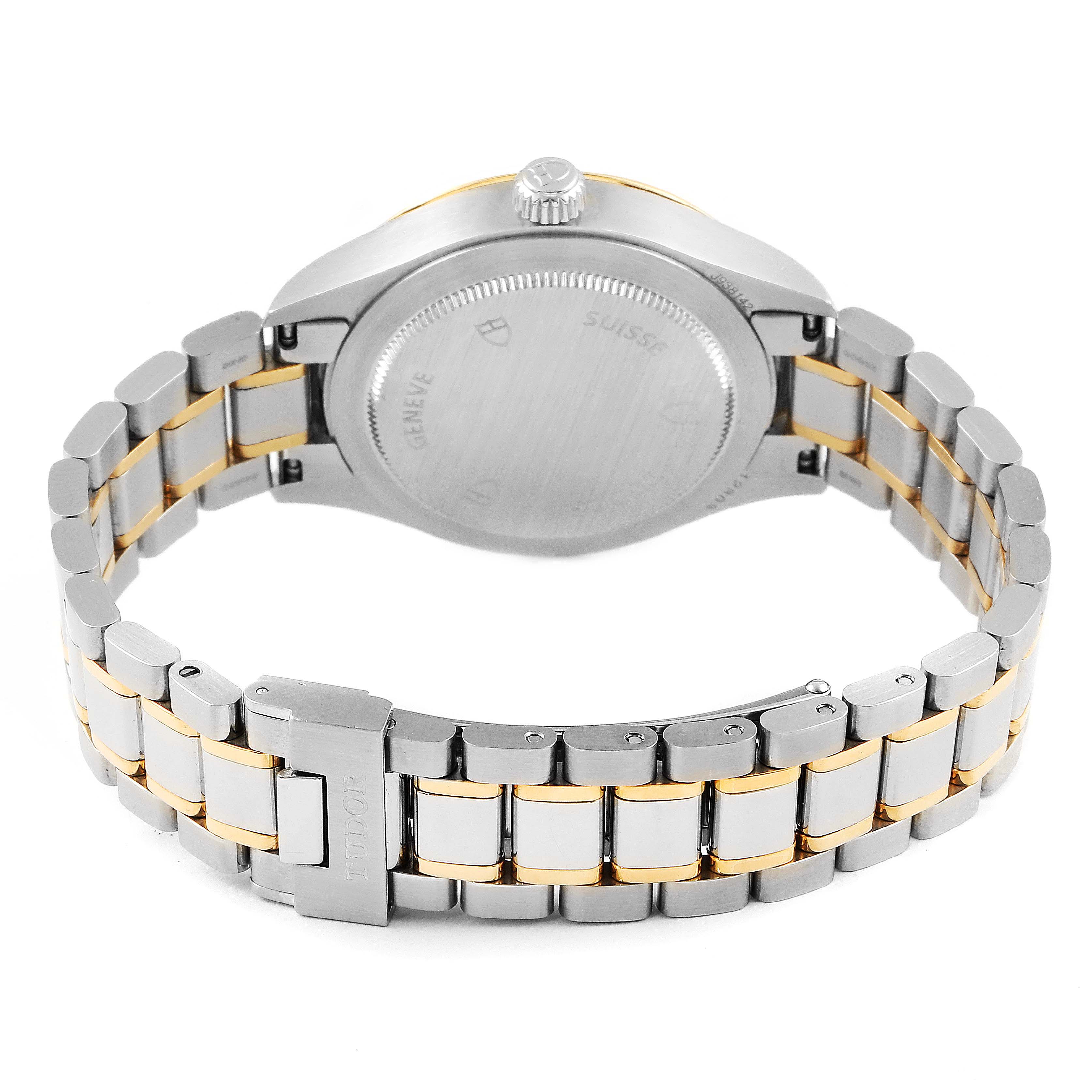 The image shows the back and bracelet of the Tudor Style M12303 Women
s Steel and Gold (two tone) Black Dial M12303 Women
s Steel and Gold (two tone) Black Dial watch, focusing on the clasp and case back.