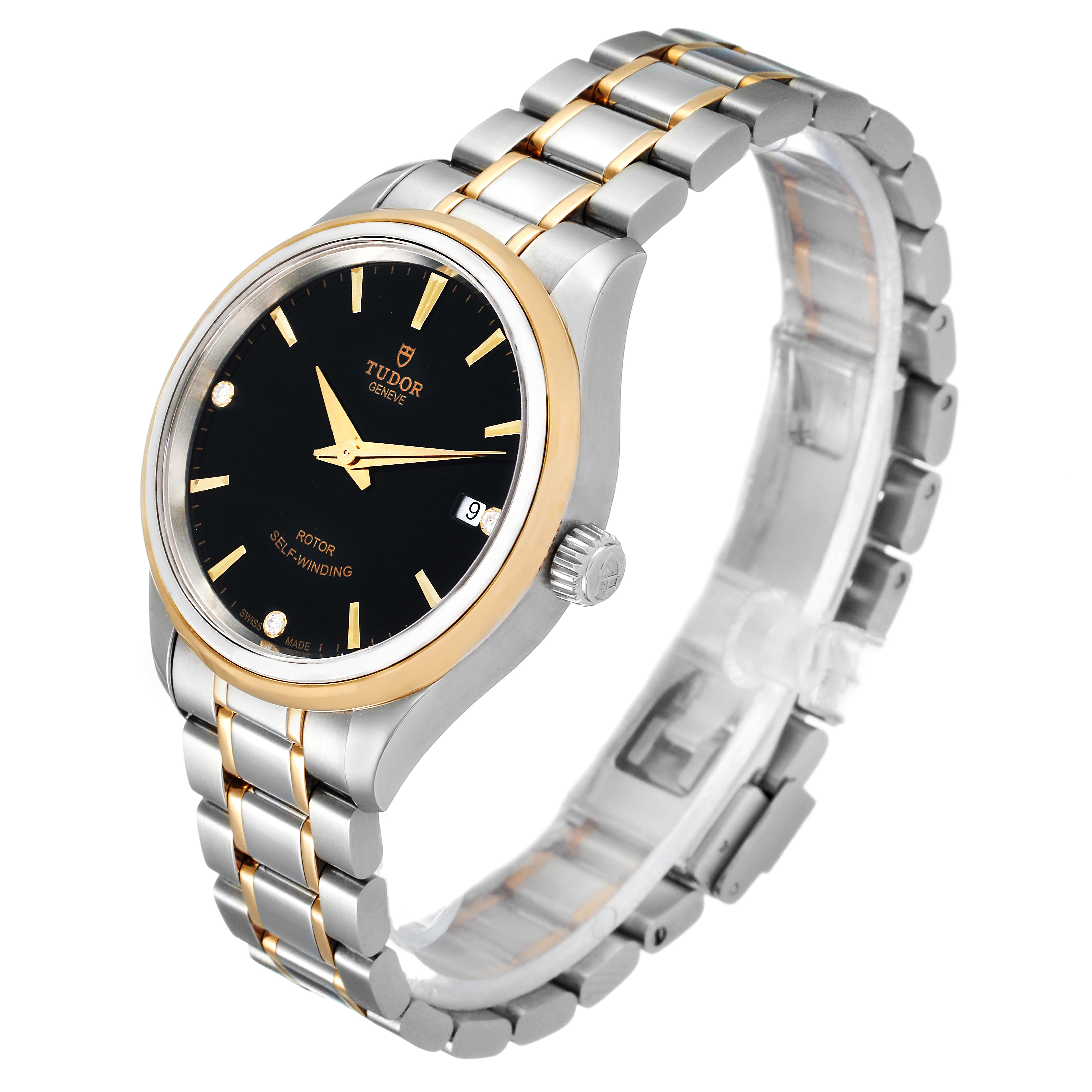 The Tudor Style M12303 Women
s Steel and Gold (two tone) Black Dial M12303 Women
s Steel and Gold (two tone) Black Dial model watch is shown at an angle displaying the face, bezel, crown, and bracelet.