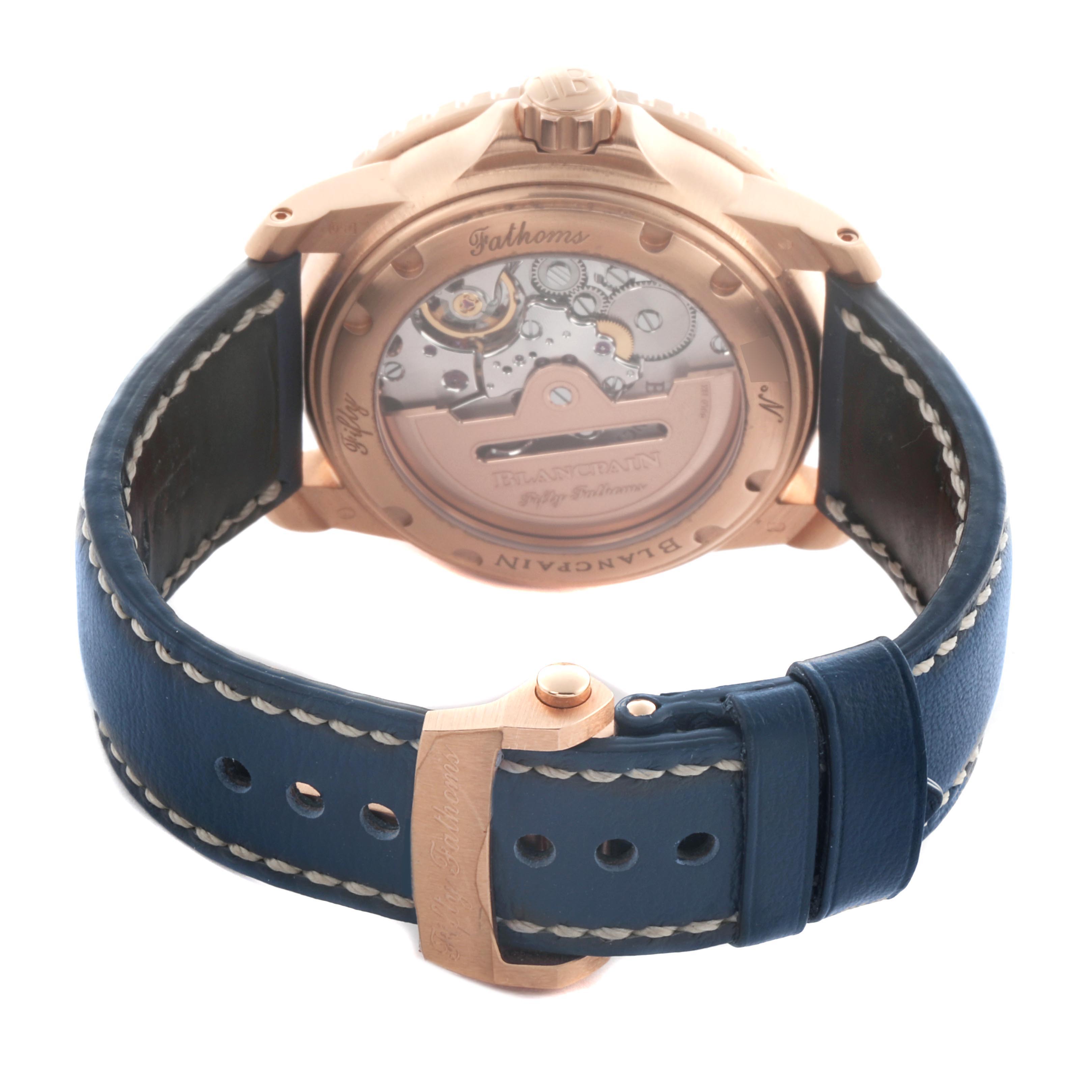 The image shows the back of a Blancpain Fifty Fathoms 5015-363-C63B Men's Rose Gold Blue Dial 5015-363-C63B Men's Rose Gold Blue Dial watch, highlighting the movement and blue leather strap.