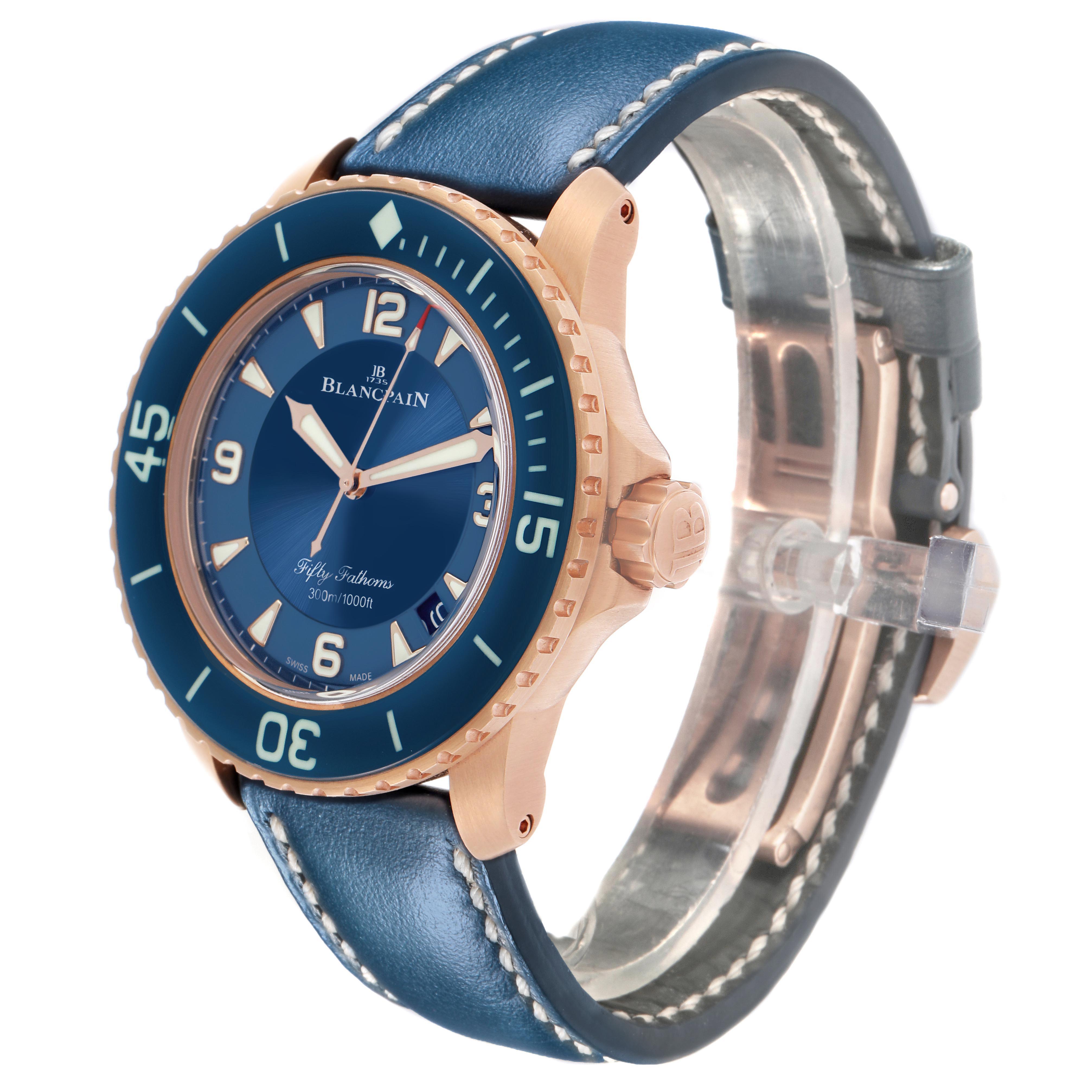 The Blancpain Fifty Fathoms 5015-363-C63B Men's Rose Gold Blue Dial watch is shown from a front-side angle, displaying its blue dial, bezel, and leather strap.