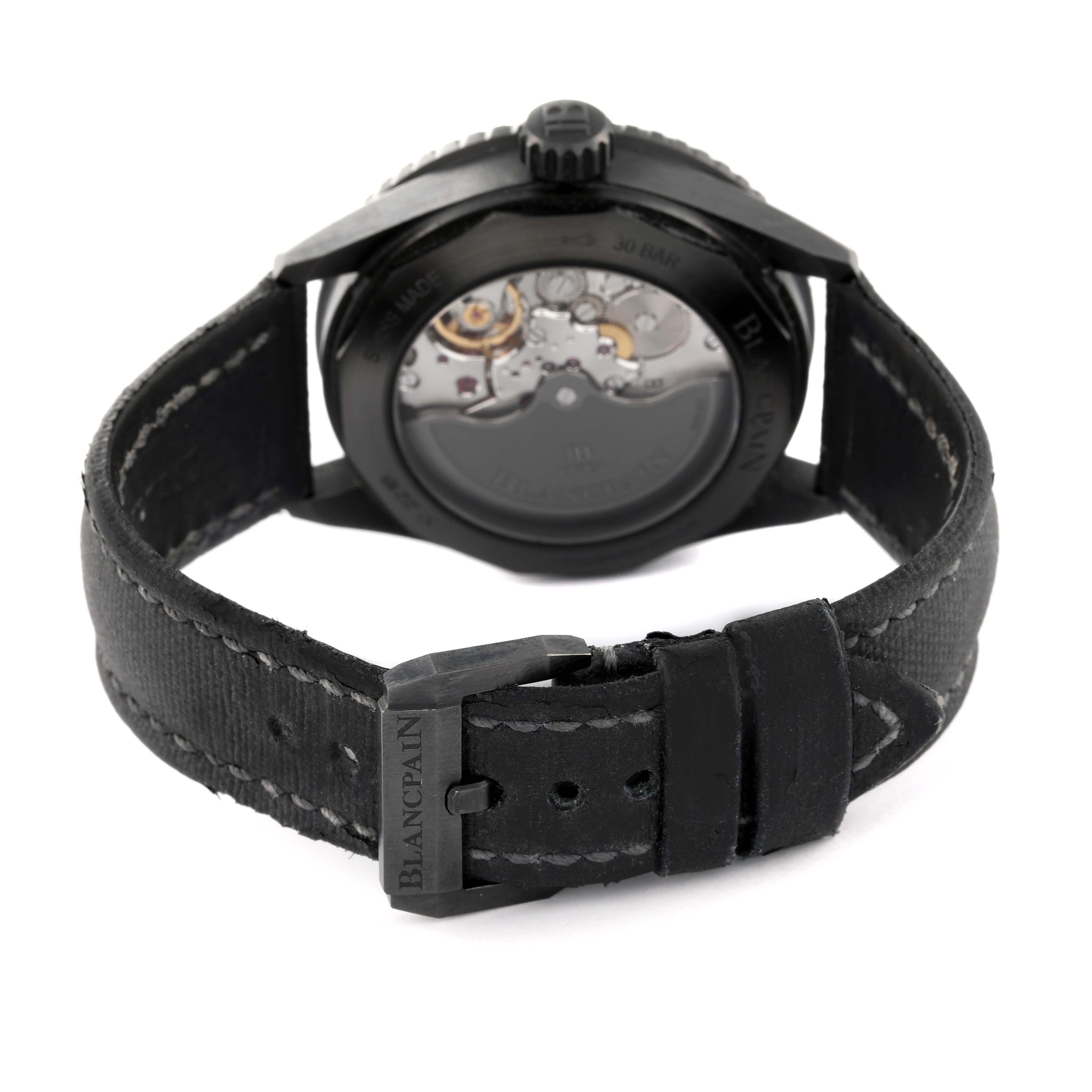 The image shows the back view of the Blancpain Fifty Fathoms 5000-0130-B52A Men
s Ceramic Black Dial 5000-0130-B52A Men
s Ceramic Black Dial watch, highlighting its strap and exposed movement.