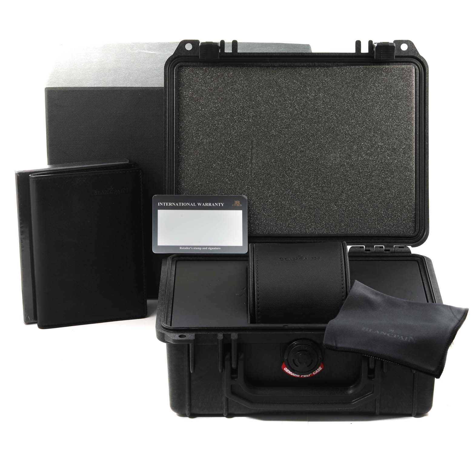 The image shows the accessories of the Blancpain Fifty Fathoms 5000-0130-B52A Men
s Ceramic Black Dial 5000-0130-B52A Men
s Ceramic Black Dial watch, including a protective case, warranty card, booklet, and cleaning cloth.