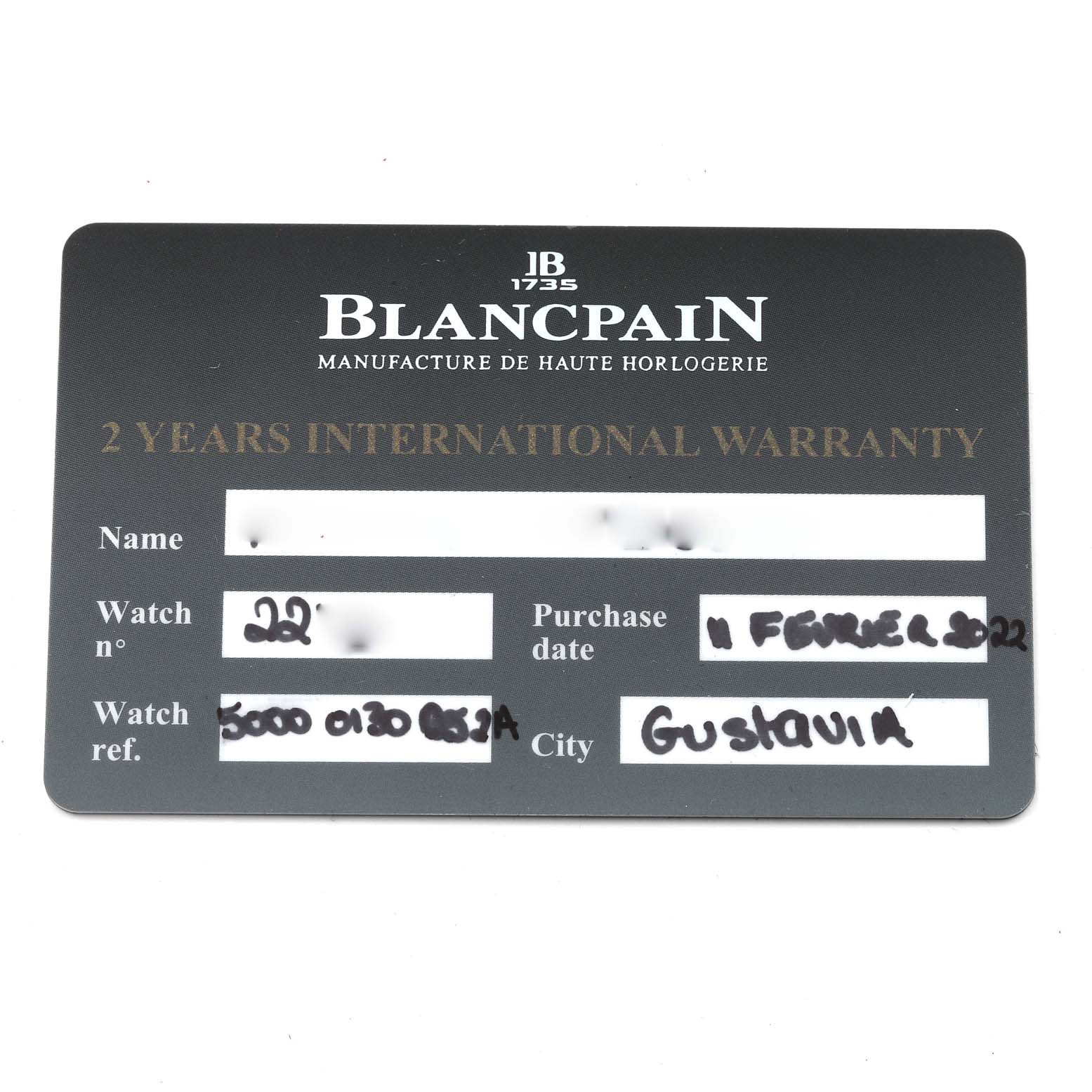 The image shows a warranty card for a Blancpain Fifty Fathoms 5000-0130-B52A Men
s Ceramic Black Dial 5000-0130-B52A Men
s Ceramic Black Dial watch, including details like watch number, purchase date, and city.