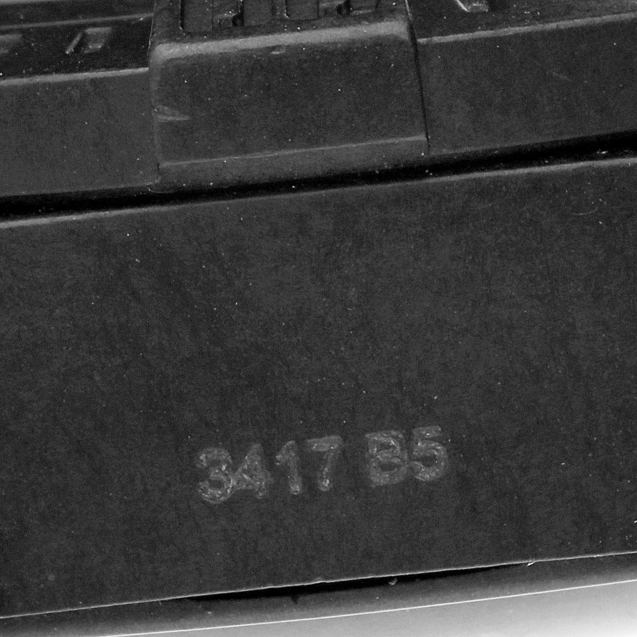 This image shows a close-up of the strap or clasp part of a Breitling Avenger XB0180 Men's Ceramic Black Dial XB0180 Men's Ceramic Black Dial watch, showcasing small details and numbers.
