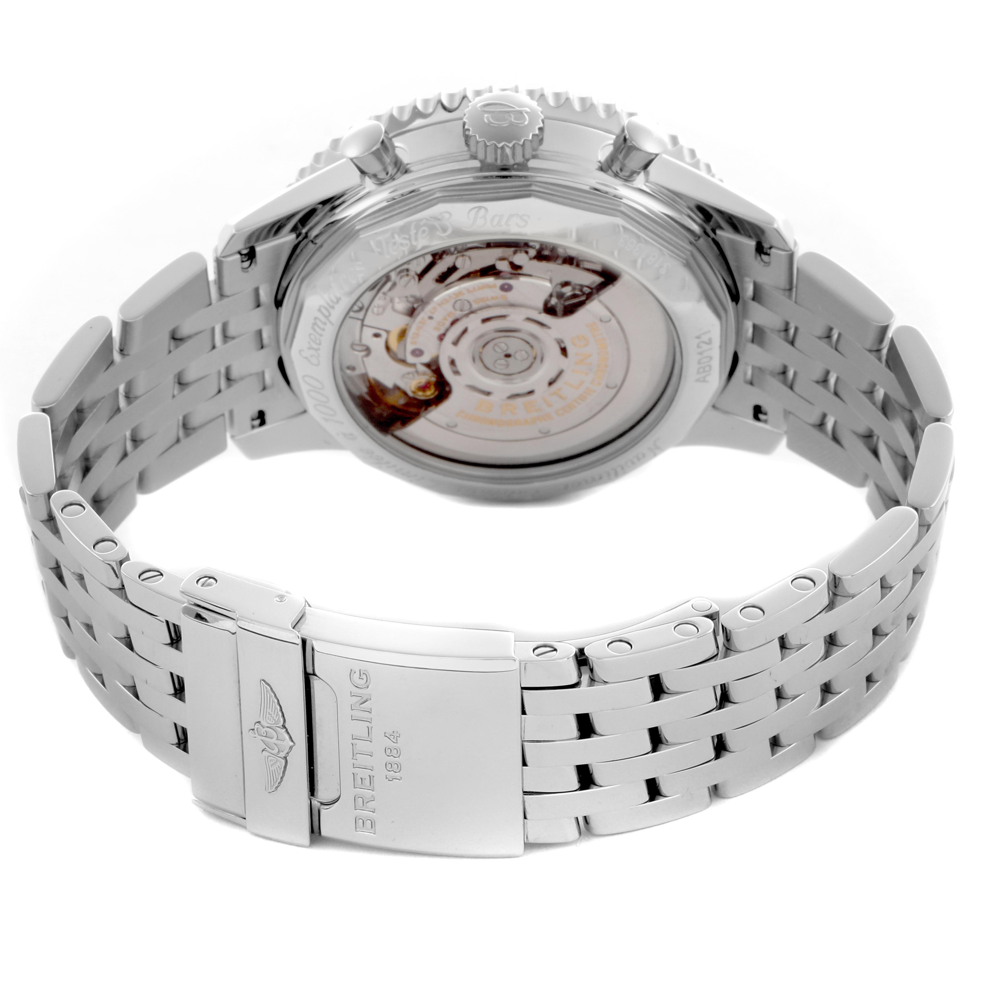 The image shows the Breitling Navitimer AB0121 Men
s Stainless Steel Blue Dial AB0121 Men
s Stainless Steel Blue Dial watch from the back, displaying its movement through the transparent case back and metal bracelet.