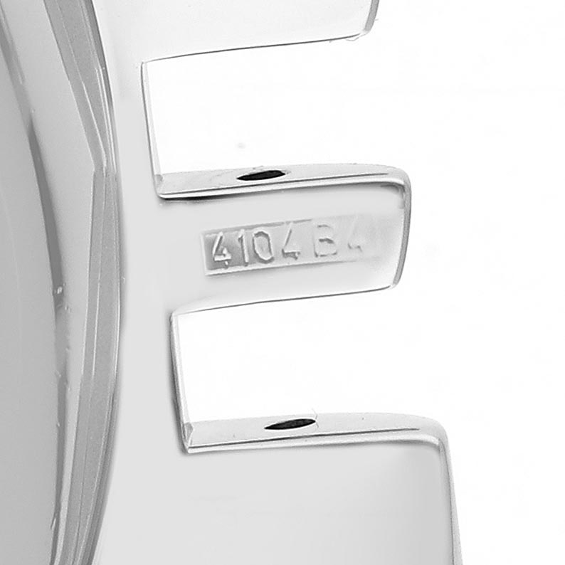 The image shows a close-up of the stainless steel band links of a Breitling Navitimer A35350 Men
s Stainless Steel Blue Dial A35350 Men
s Stainless Steel Blue Dial with a serial number engraved.