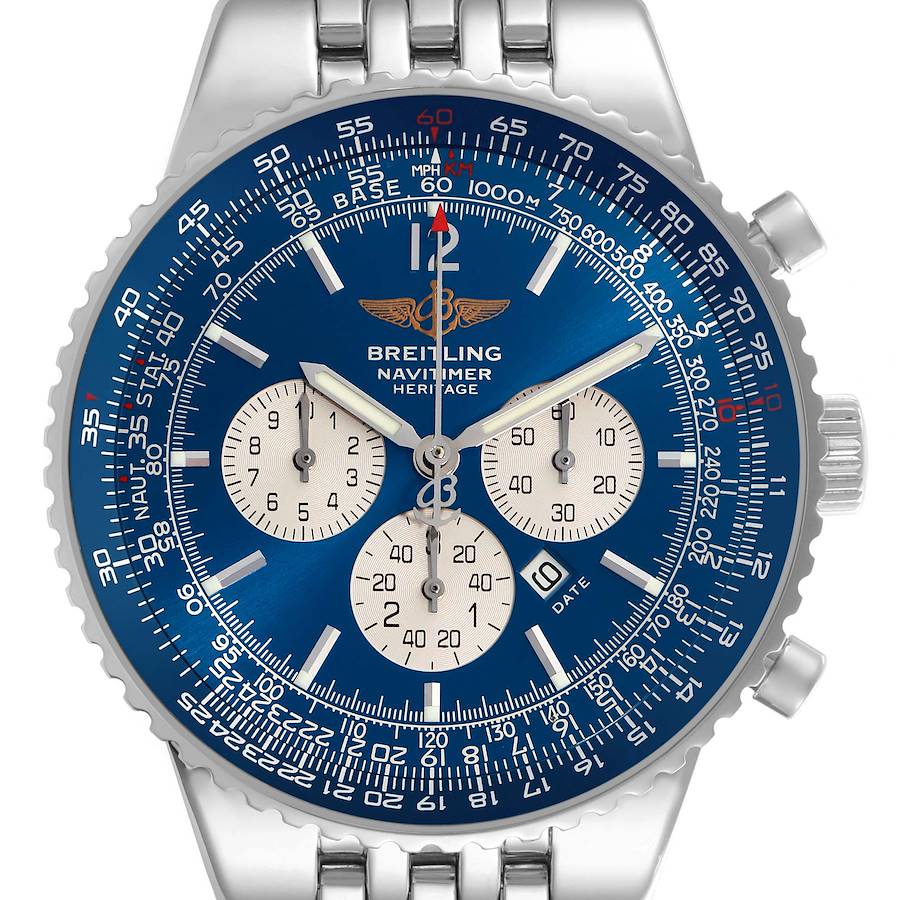 The Breitling Navitimer watch is shown from the front, displaying its blue dial, chronograph subdials, and steel bracelet.