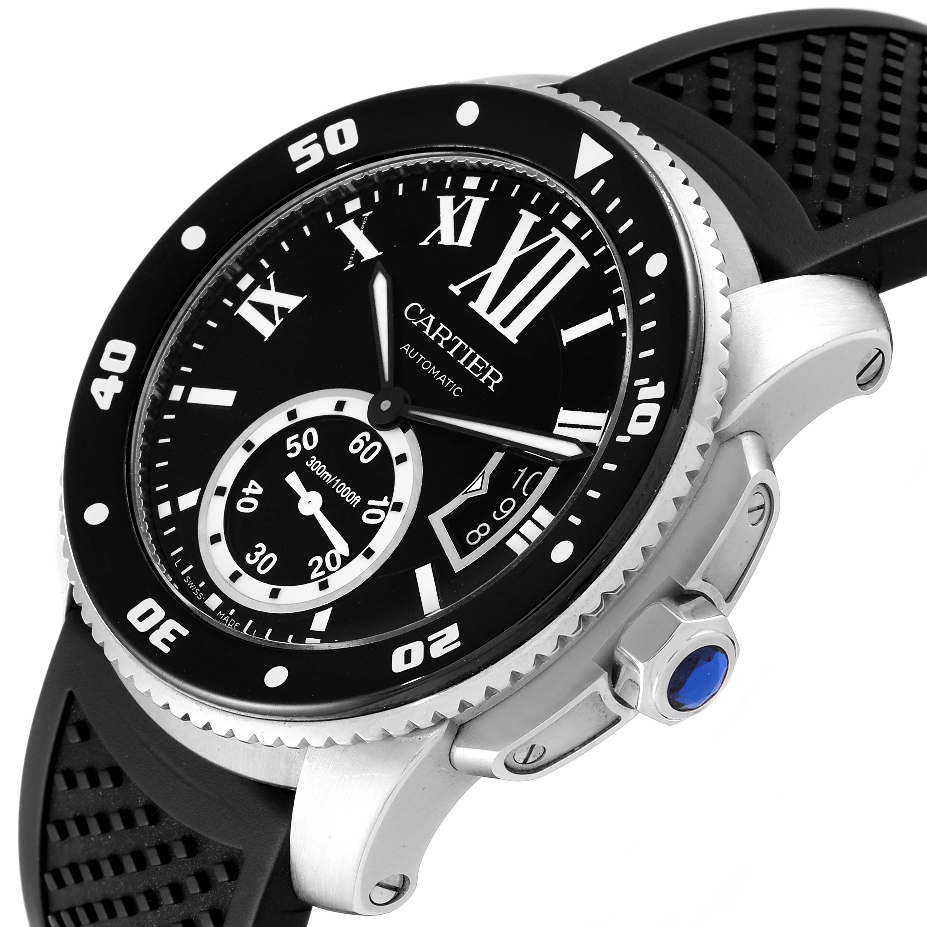 The image shows a Calibre de Cartier watch by Cartier from a close-up angle, highlighting the dial, bezel, crown, and part of the strap.