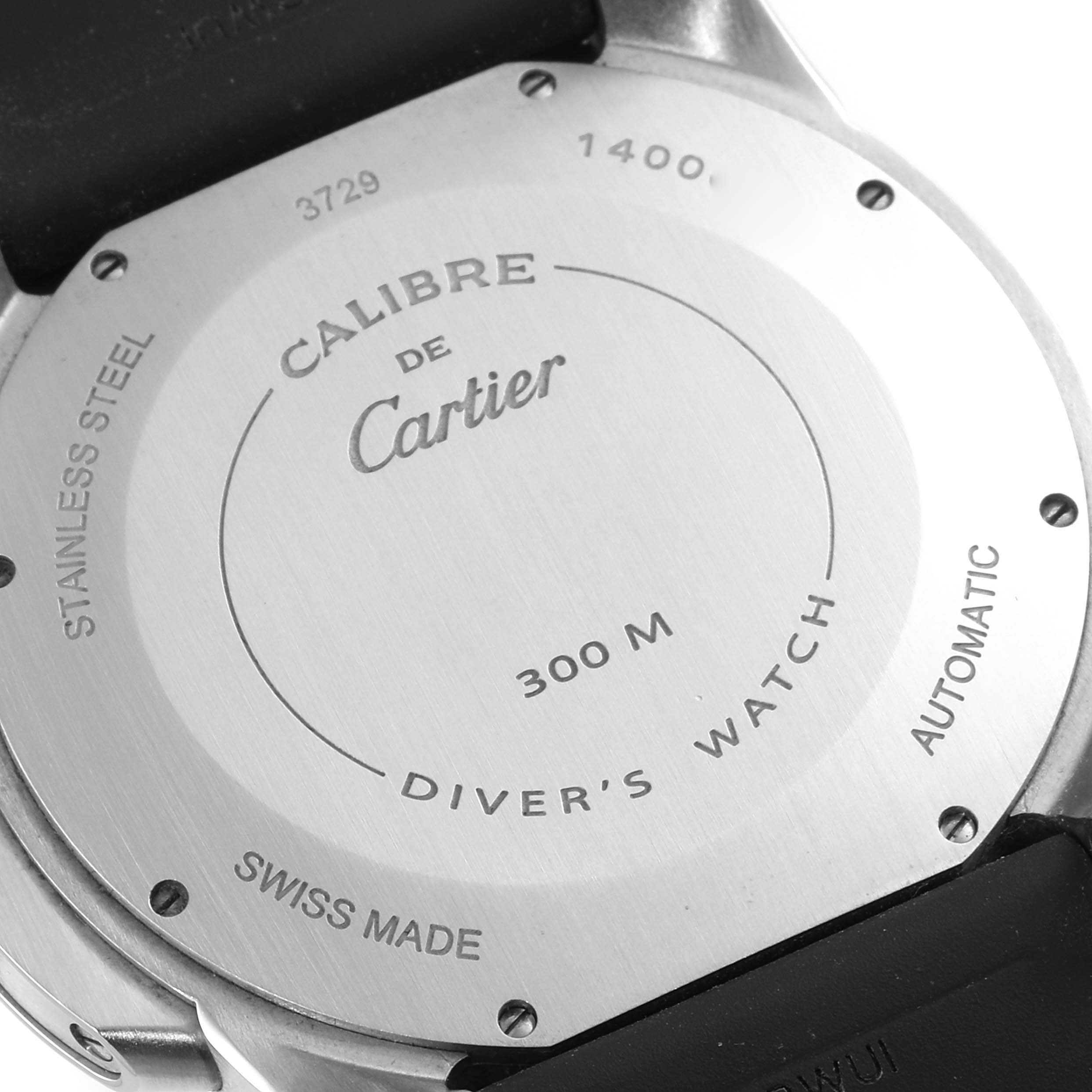 This is a rear view of a Calibre de Cartier watch by Cartier, displaying the back case and inscriptions.