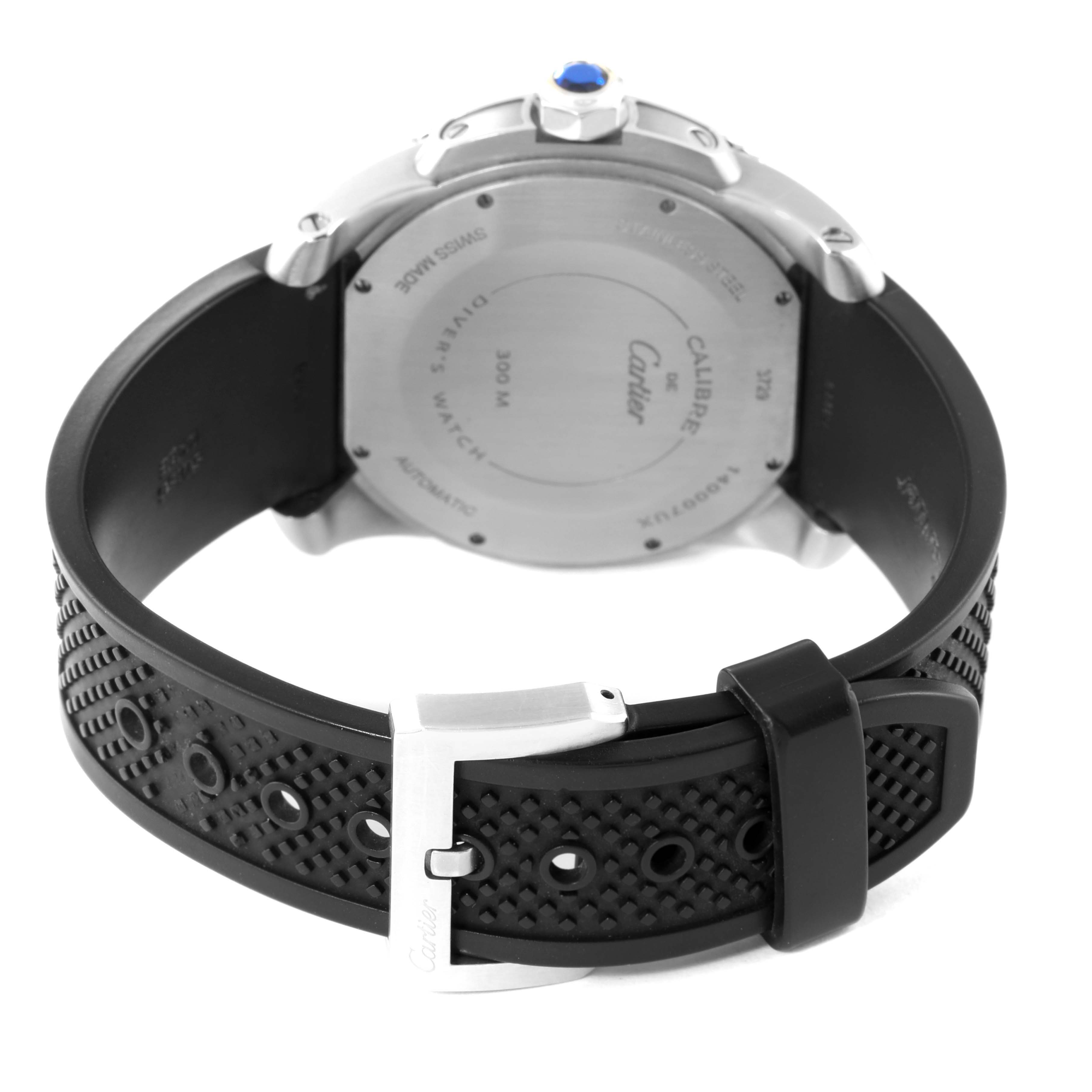 The image shows the back case and strap of a Calibre de Cartier watch by Cartier, highlighting the clasp and case back details.