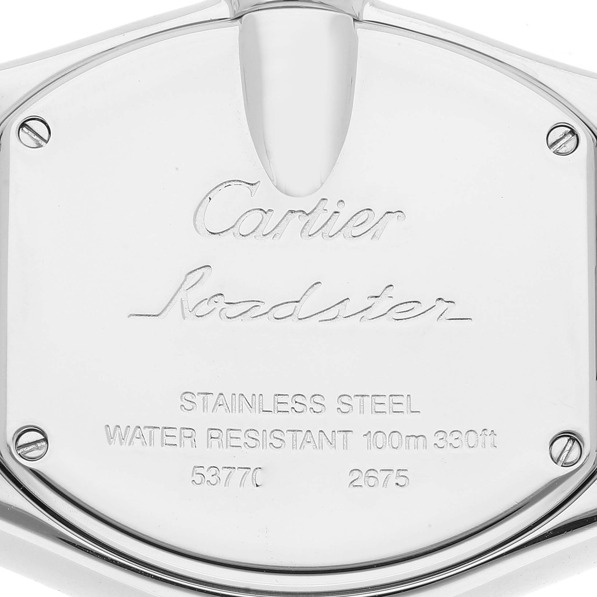 This is a close-up view of the back case of the Cartier Roadster W62017V3 Women's Stainless Steel Pink Dial W62017V3 Women's Stainless Steel Pink Dial watch, showcasing its engravings and screws.