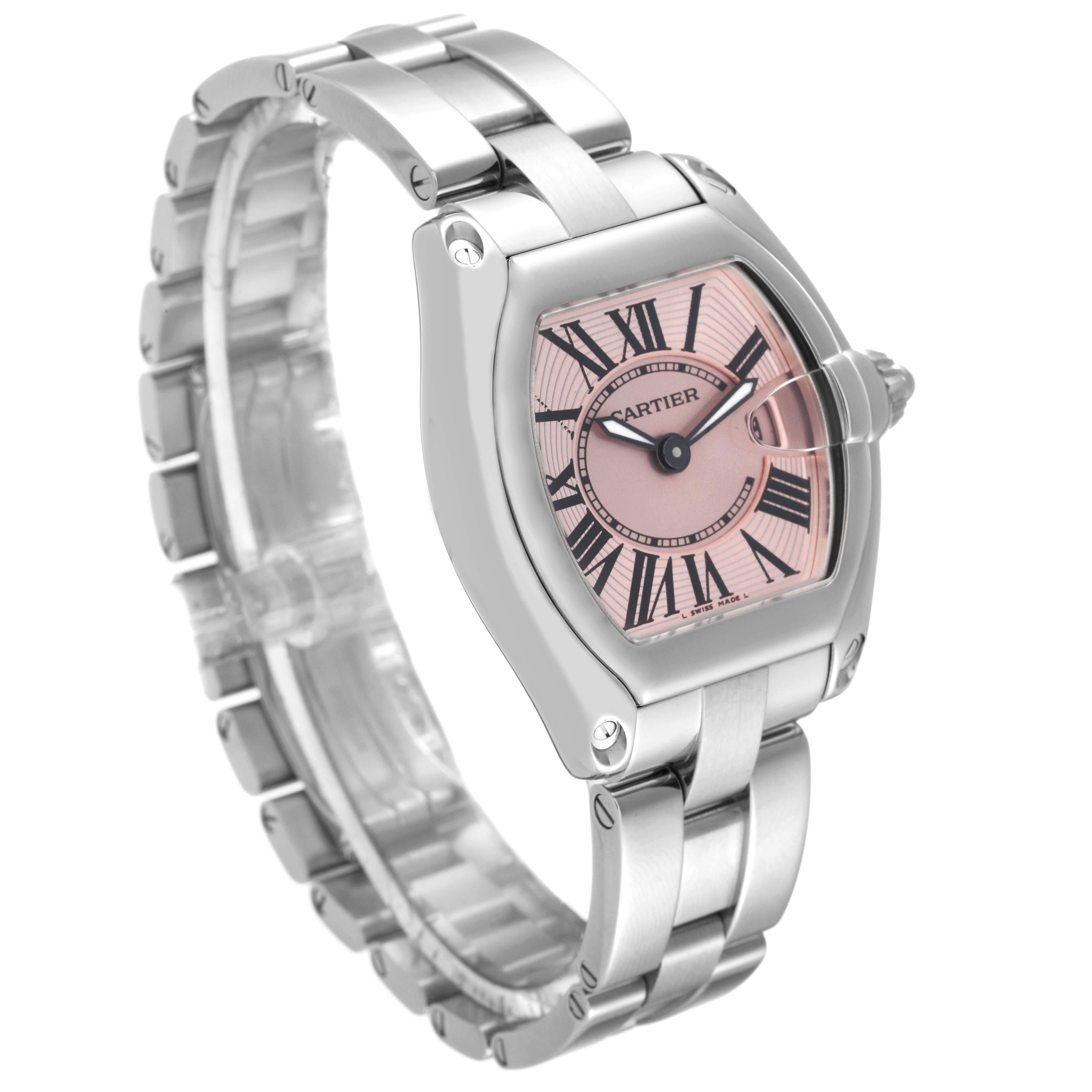 This image shows a Cartier Roadster W62017V3 Women's Stainless Steel Pink Dial W62017V3 Women's Stainless Steel Pink Dial watch at an angle highlighting its stainless steel bracelet, case, and pink Roman numeral dial.