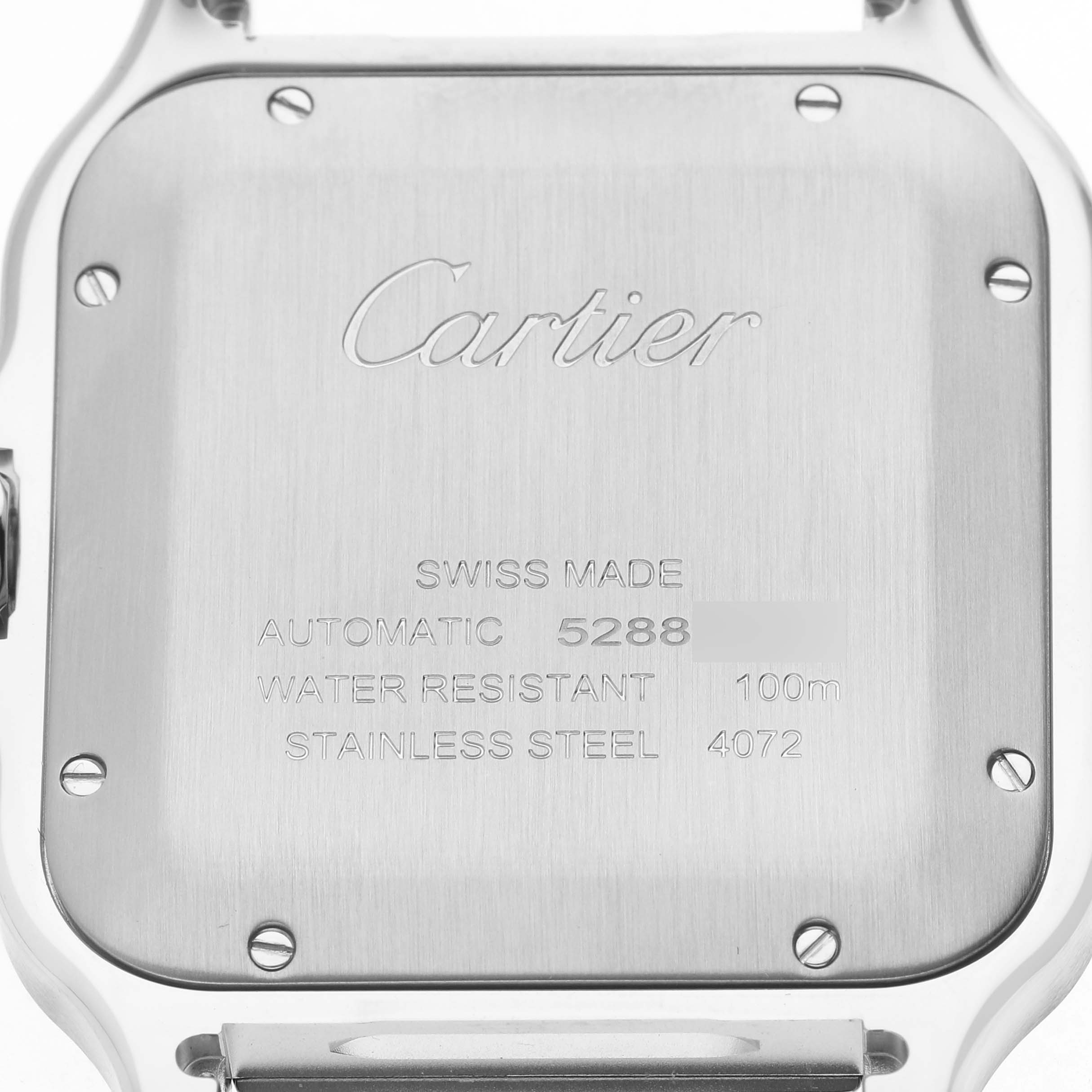 The image shows the back case of a Santos model by Cartier, highlighting engravings and screws.