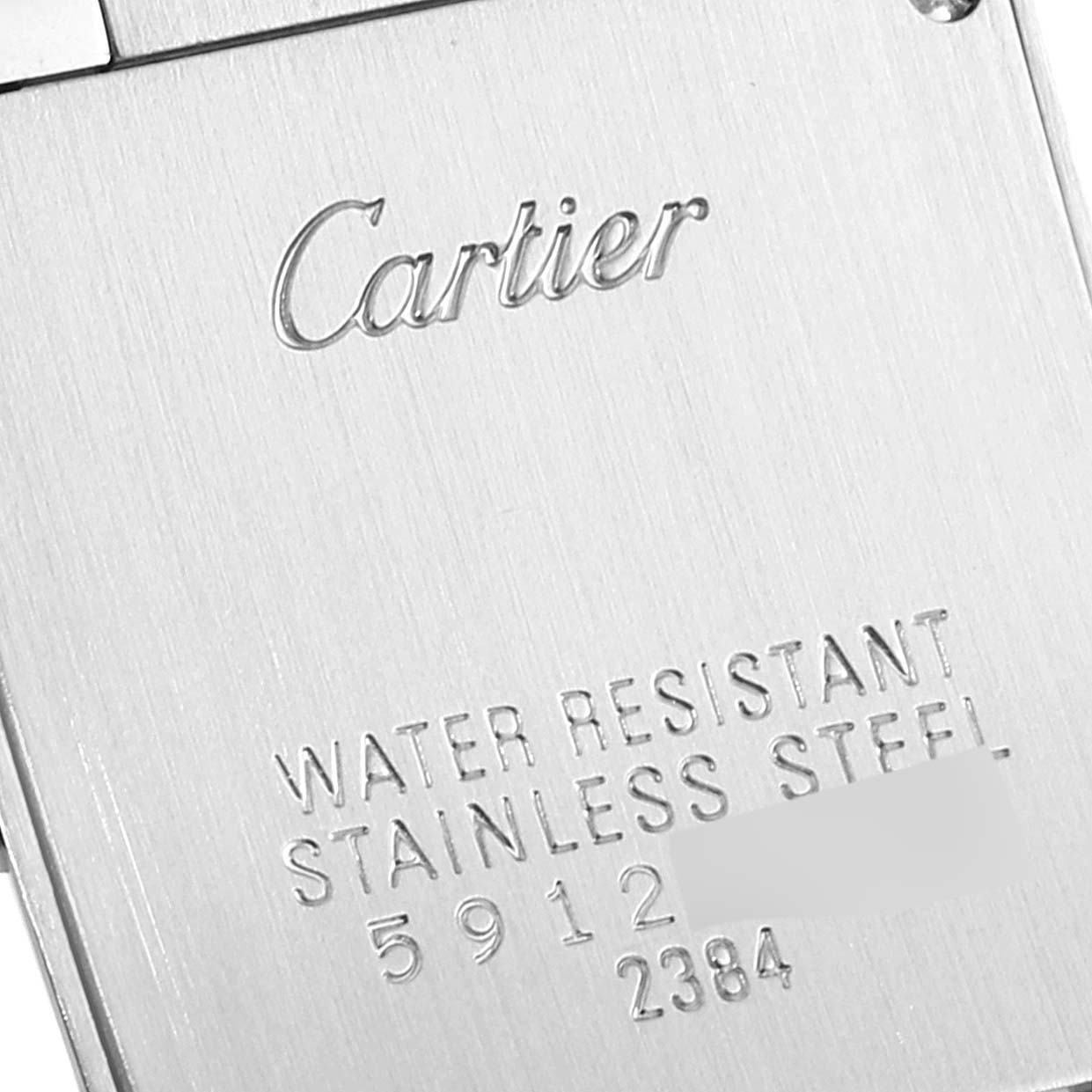 This image shows the engraved back case of the Cartier Tank Francaise W51028Q3 Women
s Stainless Steel Mother of Pearl Dial W51028Q3 Women
s Stainless Steel Mother of Pearl Dial watch, highlighting its water resistance and stainless steel composition.