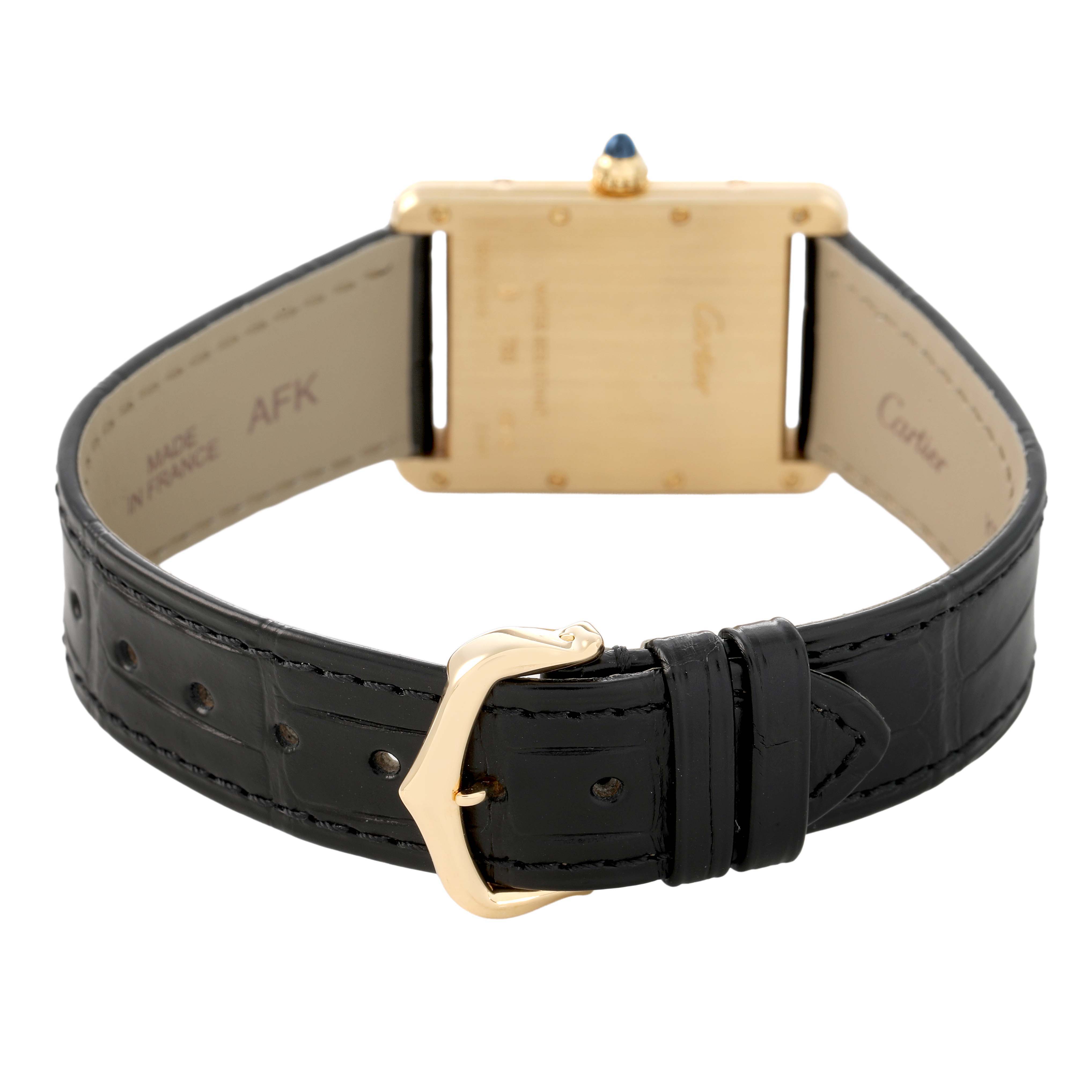 The Cartier Tank Louis W1529756 Men's Yellow Gold Silver Dial model is shown from the back, highlighting the caseback, buckle, and black leather strap.