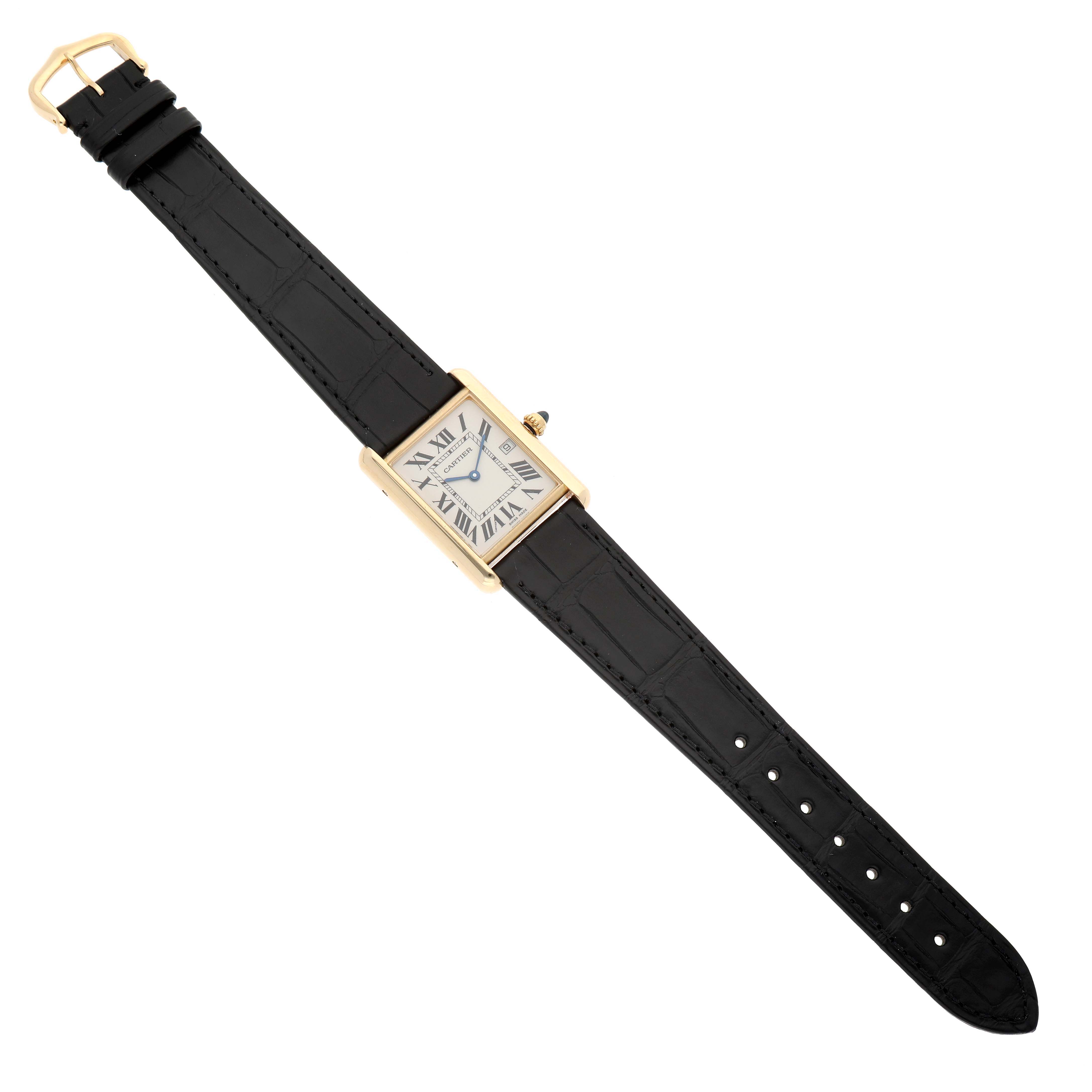 The Cartier Tank Louis W1529756 Men's Yellow Gold Silver Dial watch is shown from a top-down angle, displaying the rectangular dial, black strap, and gold case.