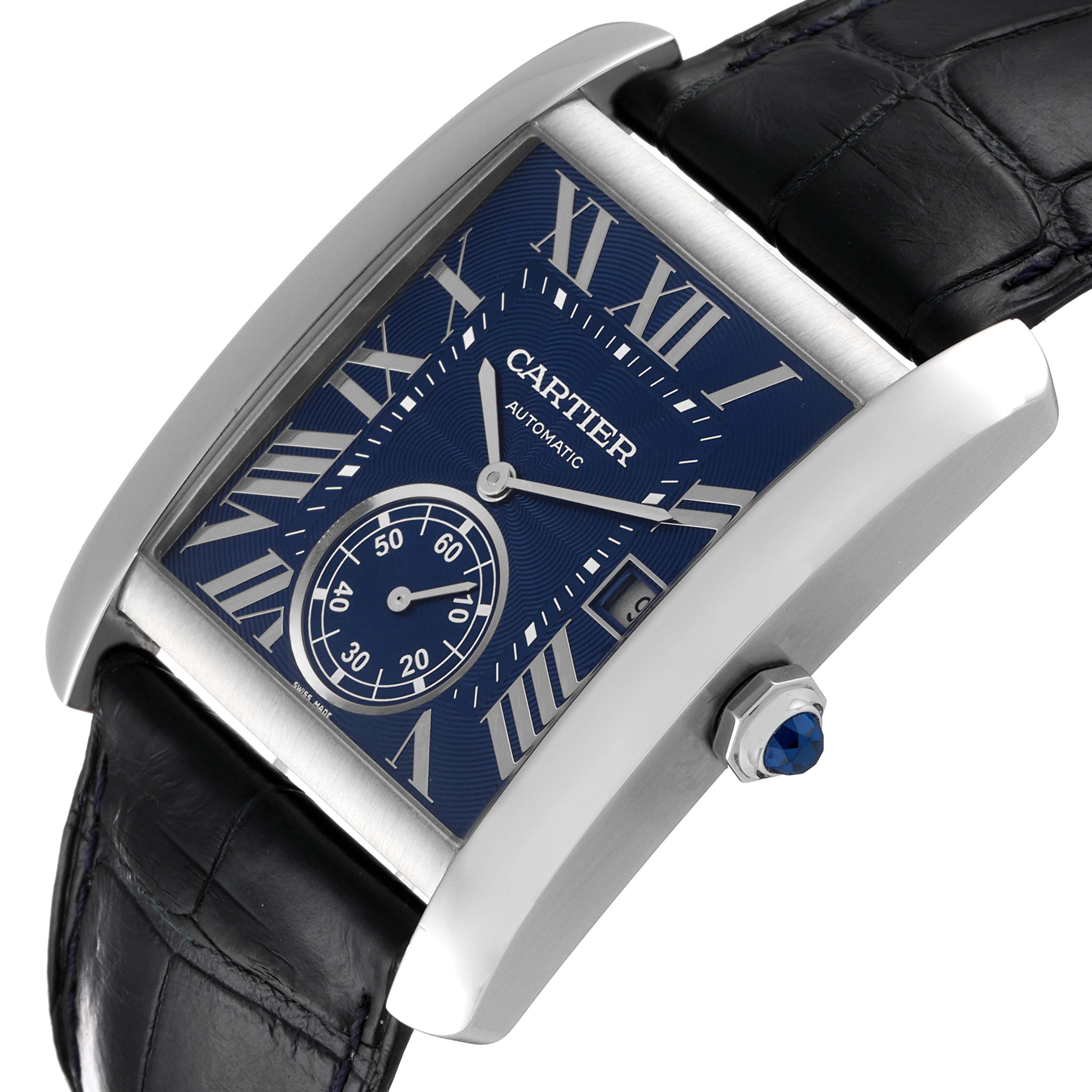 The Cartier Tank MC WSTA0010 Men's Stainless Steel Blue Dial WSTA0010 Men's Stainless Steel Blue Dial watch shown from an angled top view features a blue dial, Roman numerals, sub-dial, and black leather strap.