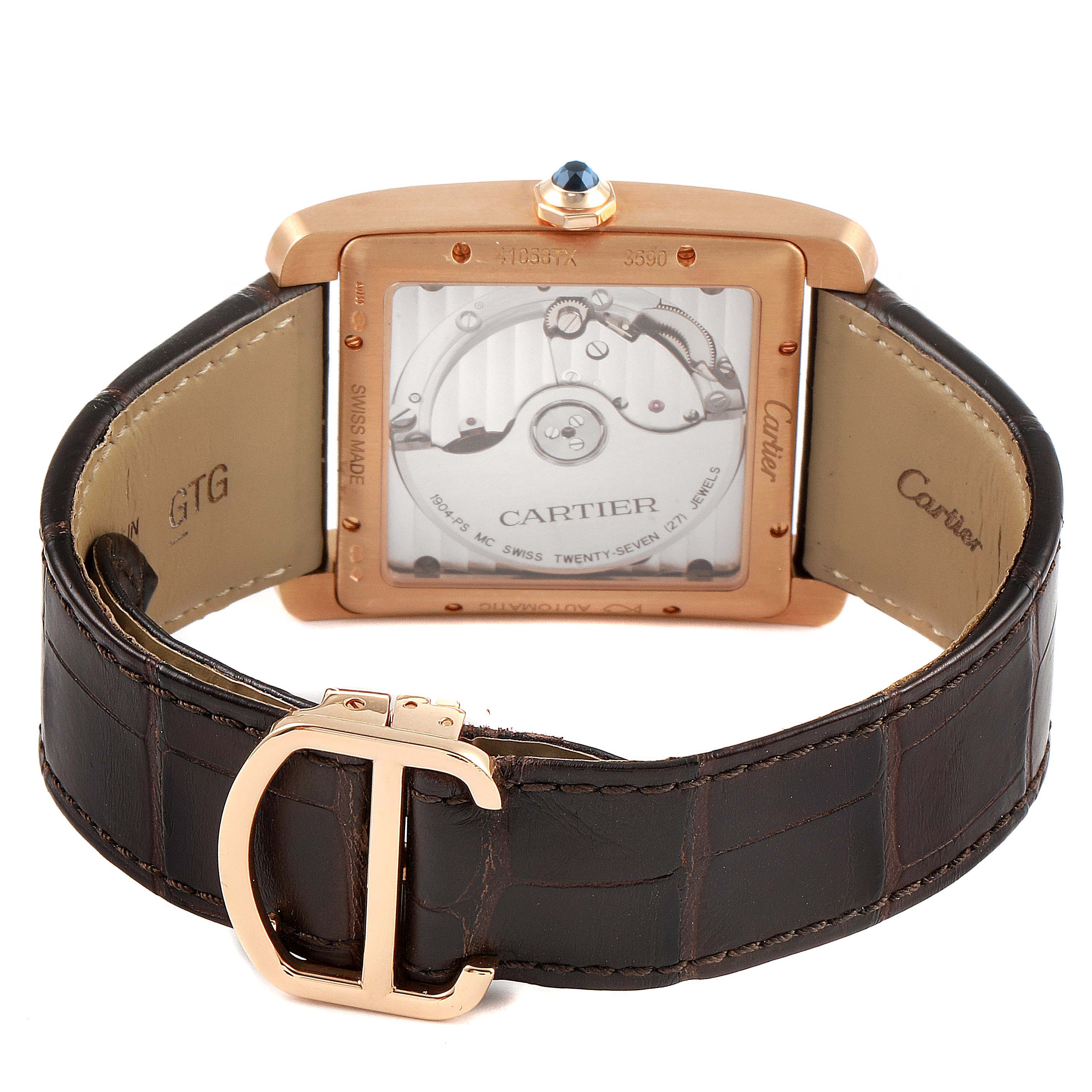 The image shows the back of a Cartier Tank MC W5330002 Men's Rose Gold Brown Dial W5330002 Men's Rose Gold Brown Dial watch, displaying its movement and leather strap with a Cartier buckle.