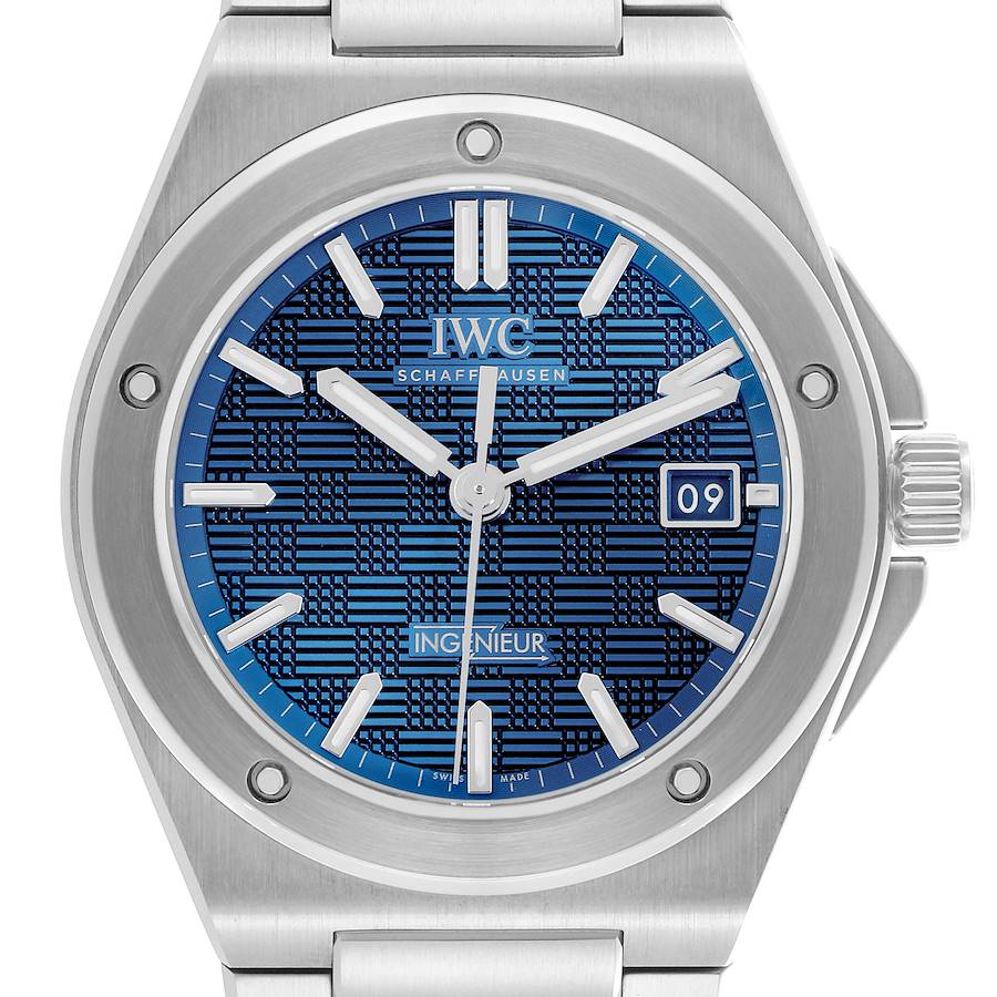 The IWC Ingenieur watch is shown from the front, detailing its blue textured dial, hands, indices, and date window.