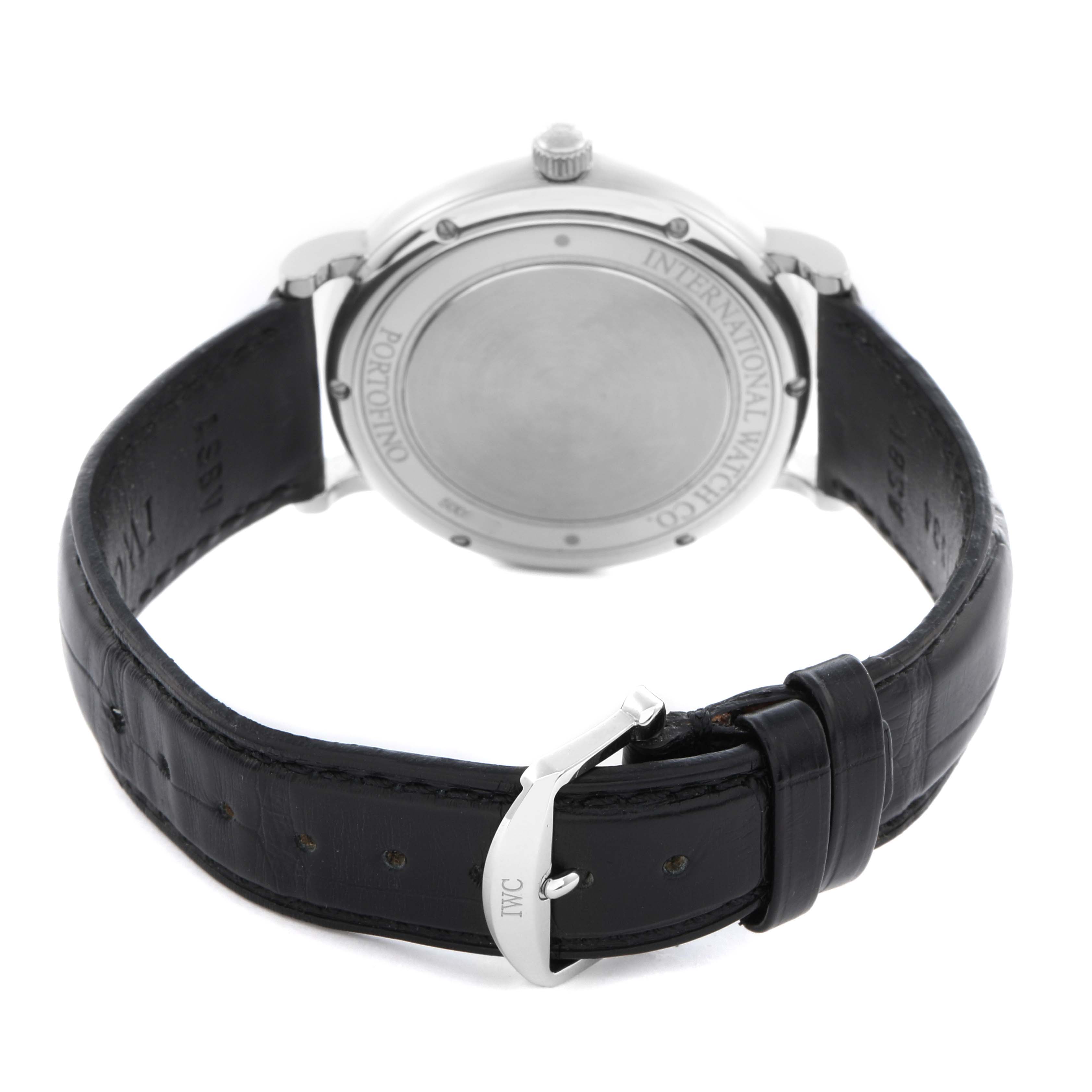The image shows the back case and leather strap of an IWC Portofino IW356501 Men
s Stainless Steel Silver Dial IW356501 Men
s Stainless Steel Silver Dial watch, highlighting its buckle and clasp.