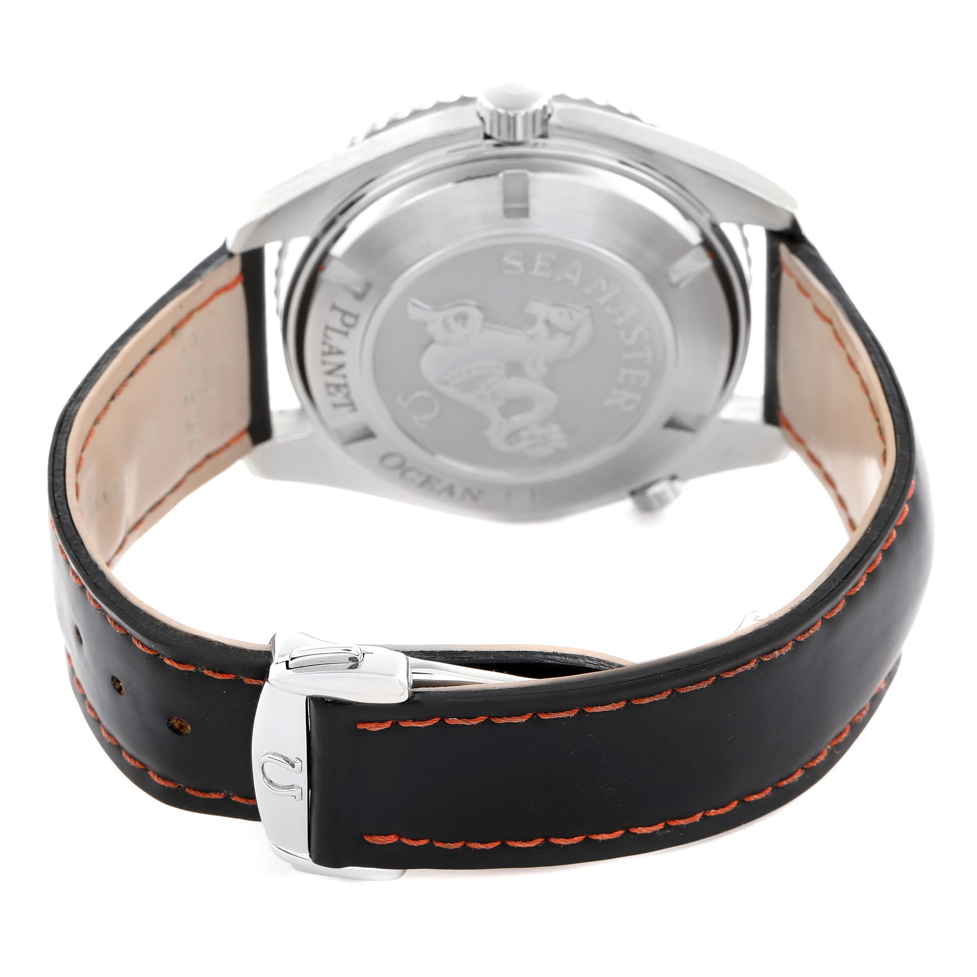 The image shows the back of the Omega Planet Ocean 232.32.42.21.01.001 Men
s Stainless Steel Black Dial 232.32.42.21.01.001 Men
s Stainless Steel Black Dial watch, highlighting the case back and leather strap with orange stitching.