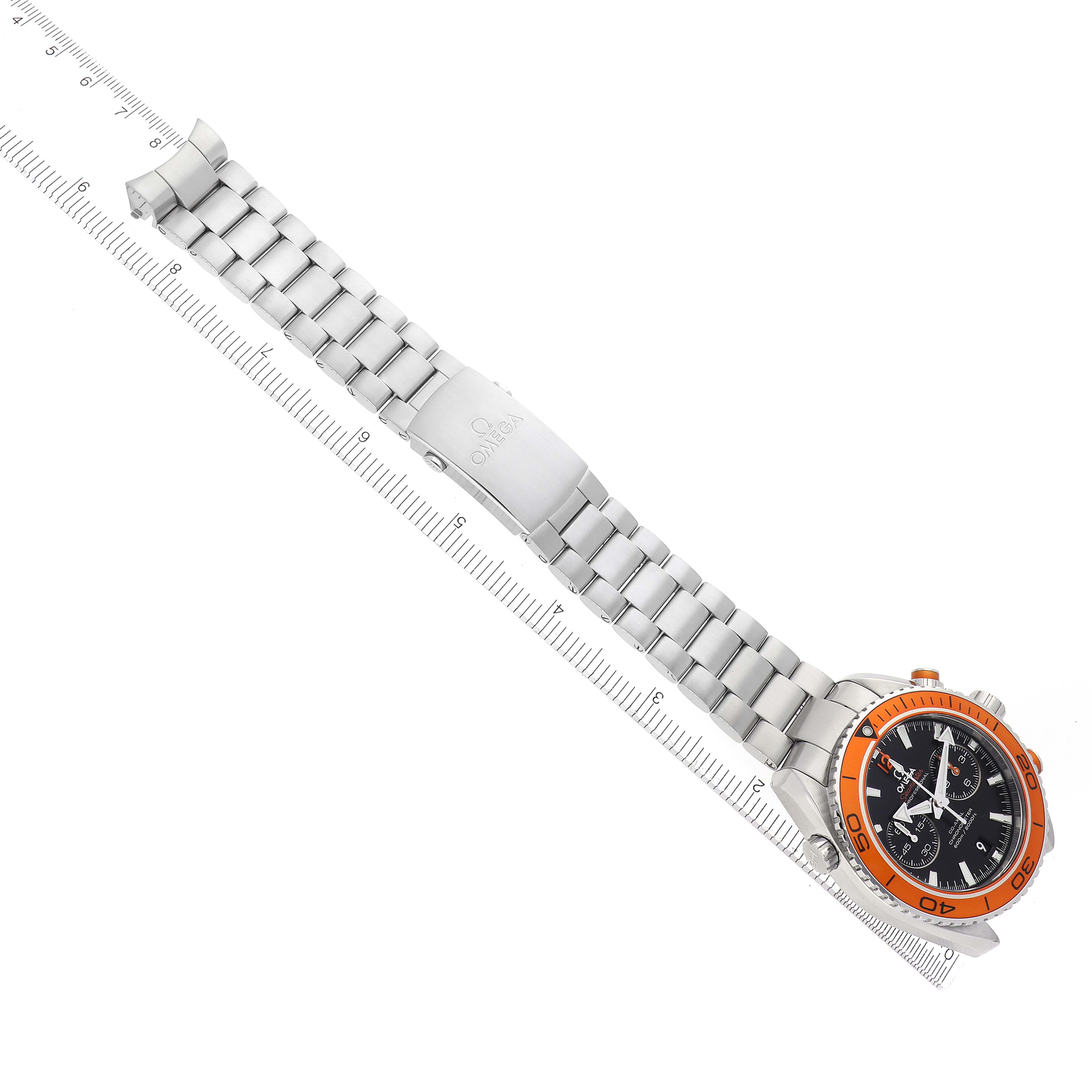 The Omega Planet Ocean 232.30.46.51.01.002 Men
s Stainless Steel Black Dial 232.30.46.51.01.002 Men
s Stainless Steel Black Dial watch is shown from an angled top view, highlighting its orange bezel and metal bracelet.