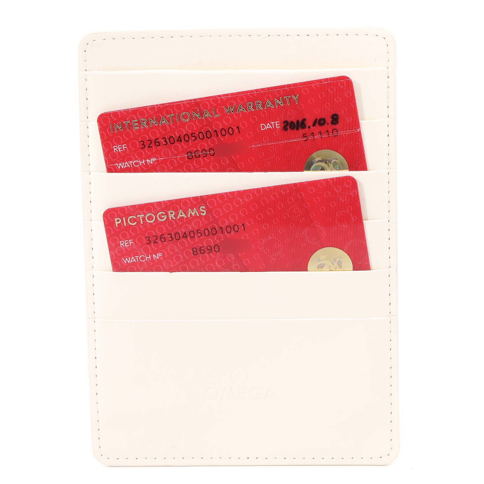 The image shows a white Omega cardholder containing International Warranty and Pictograms cards for the Omega Speedmaster 326.30.40.50.01.001 Men
s Stainless Steel Black Dial 326.30.40.50.01.001 Men
s Stainless Steel Black Dial model.