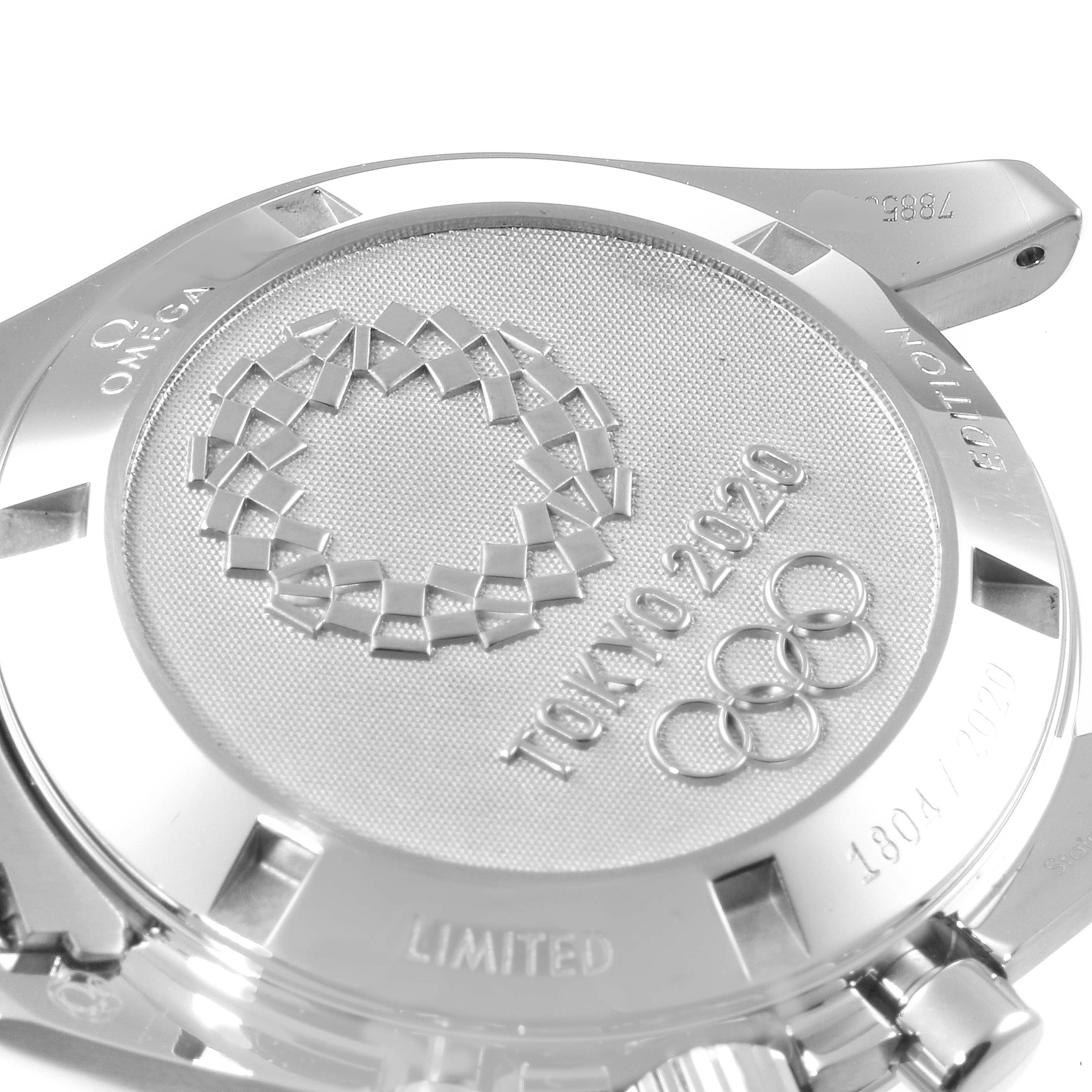 This image is a close-up of the back case of an Omega Speedmaster 522.30.42.30.03.001 Men's Stainless Steel Blue Dial 522.30.42.30.03.001 Men's Stainless Steel Blue Dial watch, showcasing the Tokyo 2020 limited edition engraving.