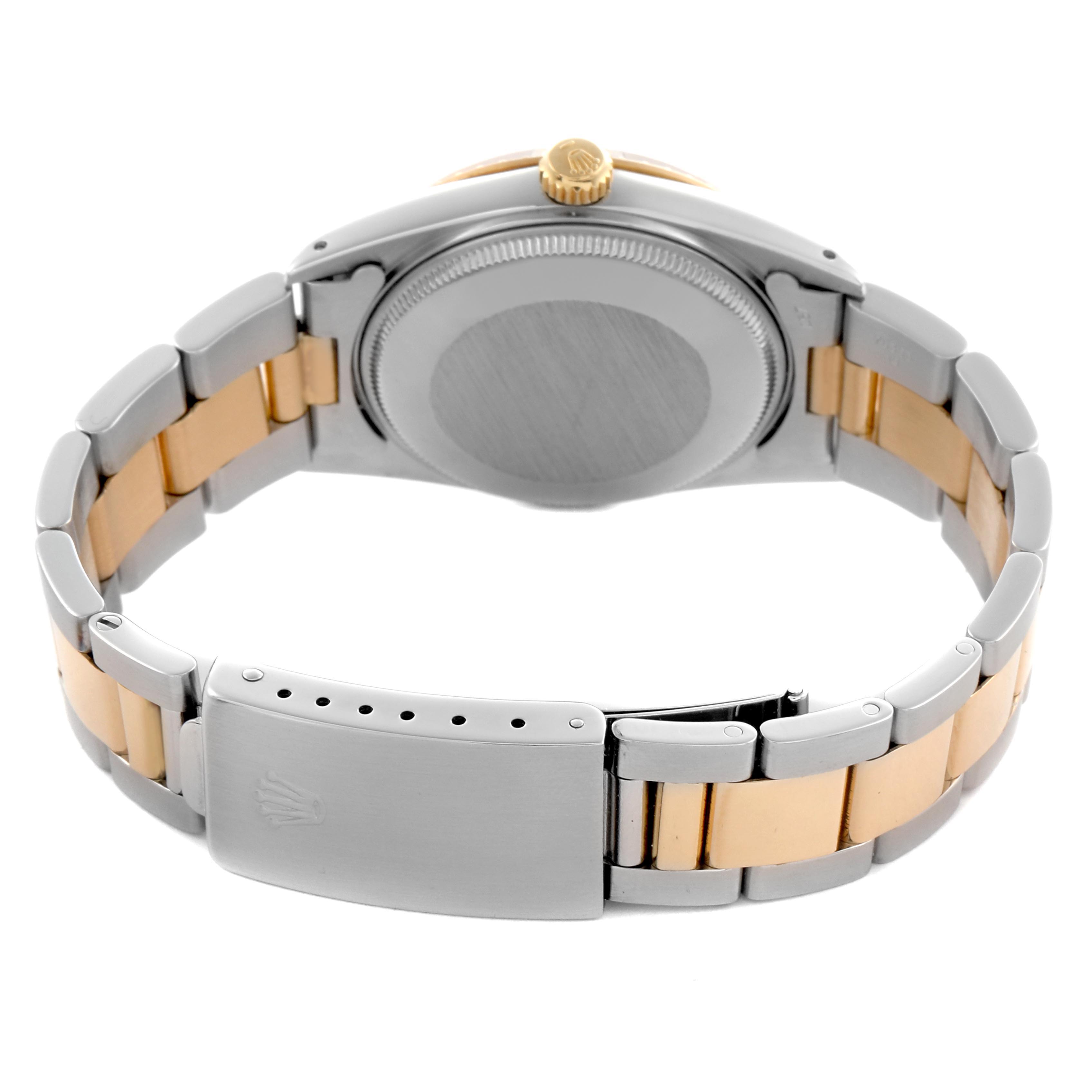 The image shows the back and bracelet of a Rolex Date 15053 Men
s Steel and Gold (two tone) Champagne Dial 15053 Men
s Steel and Gold (two tone) Champagne Dial watch, highlighting the clasp and crown from the rear angle.